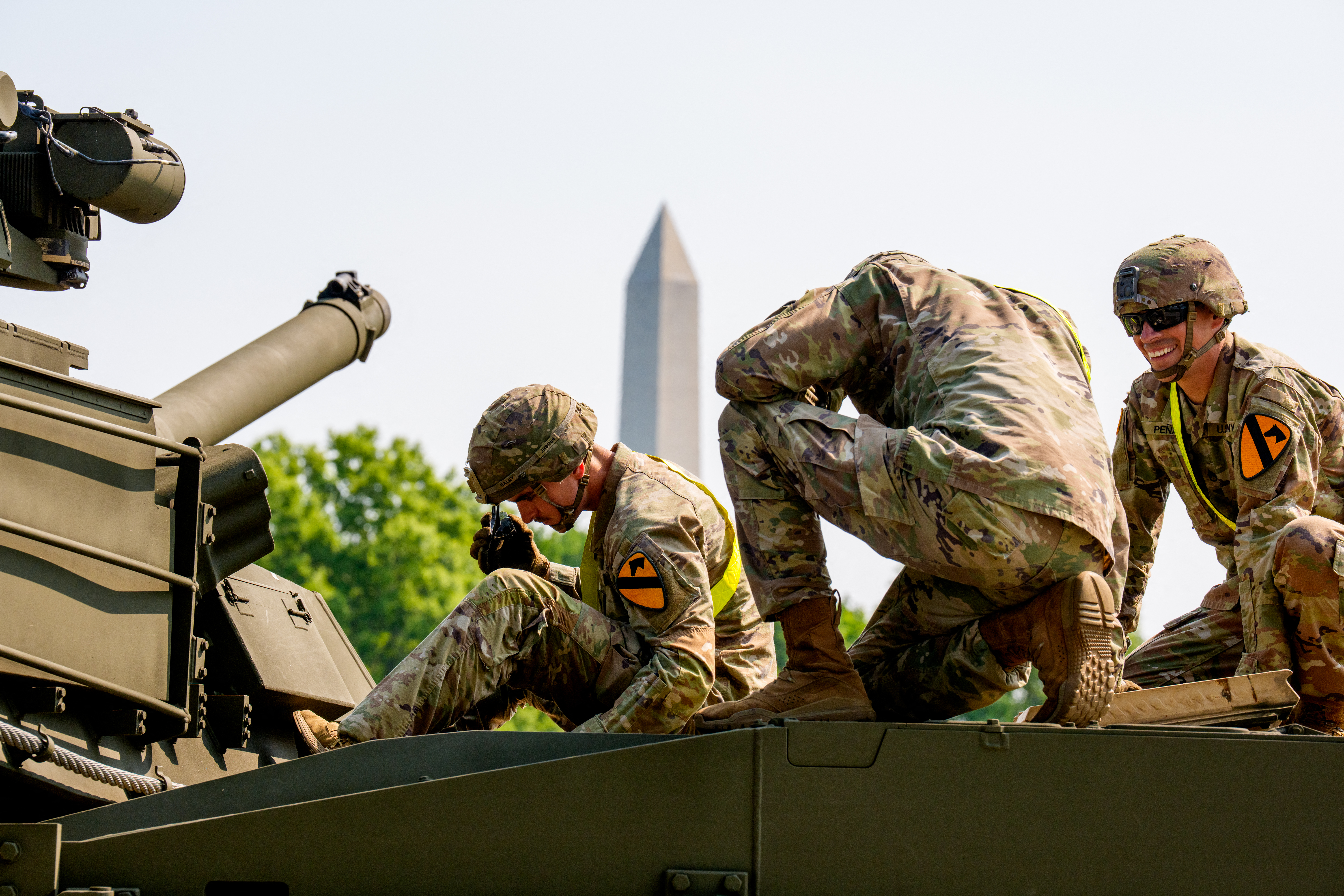 US Army soldiers work on military vehicles in West Potomac Park in Washington, DC