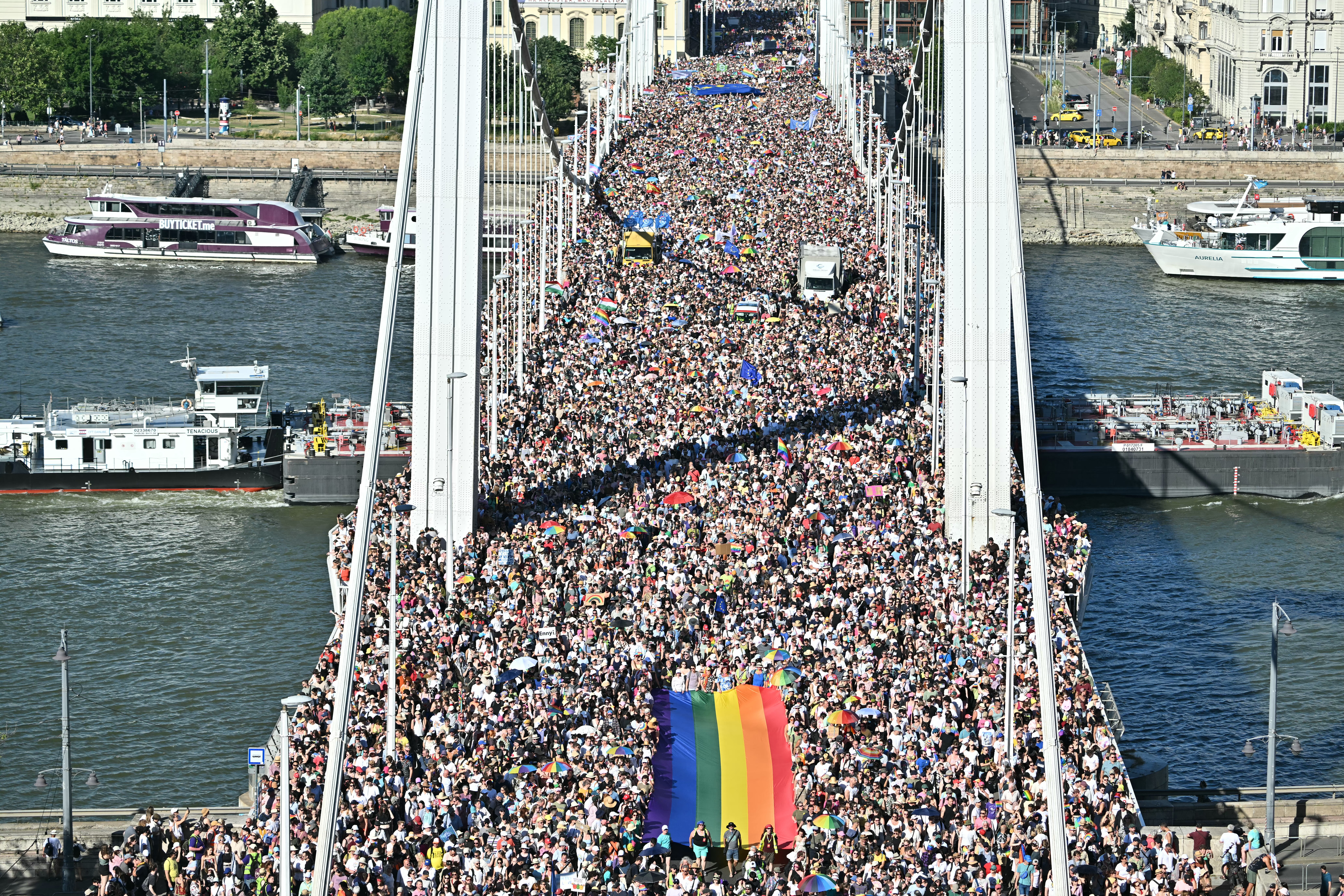 people march on a bridge