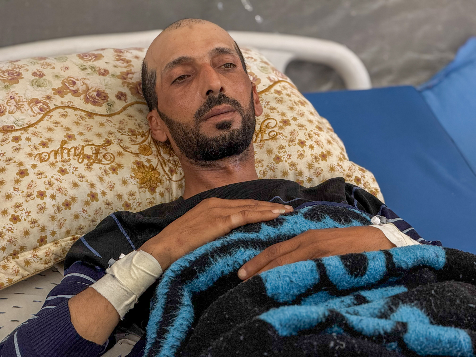 Khaled al-Lahham went to the distribution point to try to secure food for the 10 family members he supports