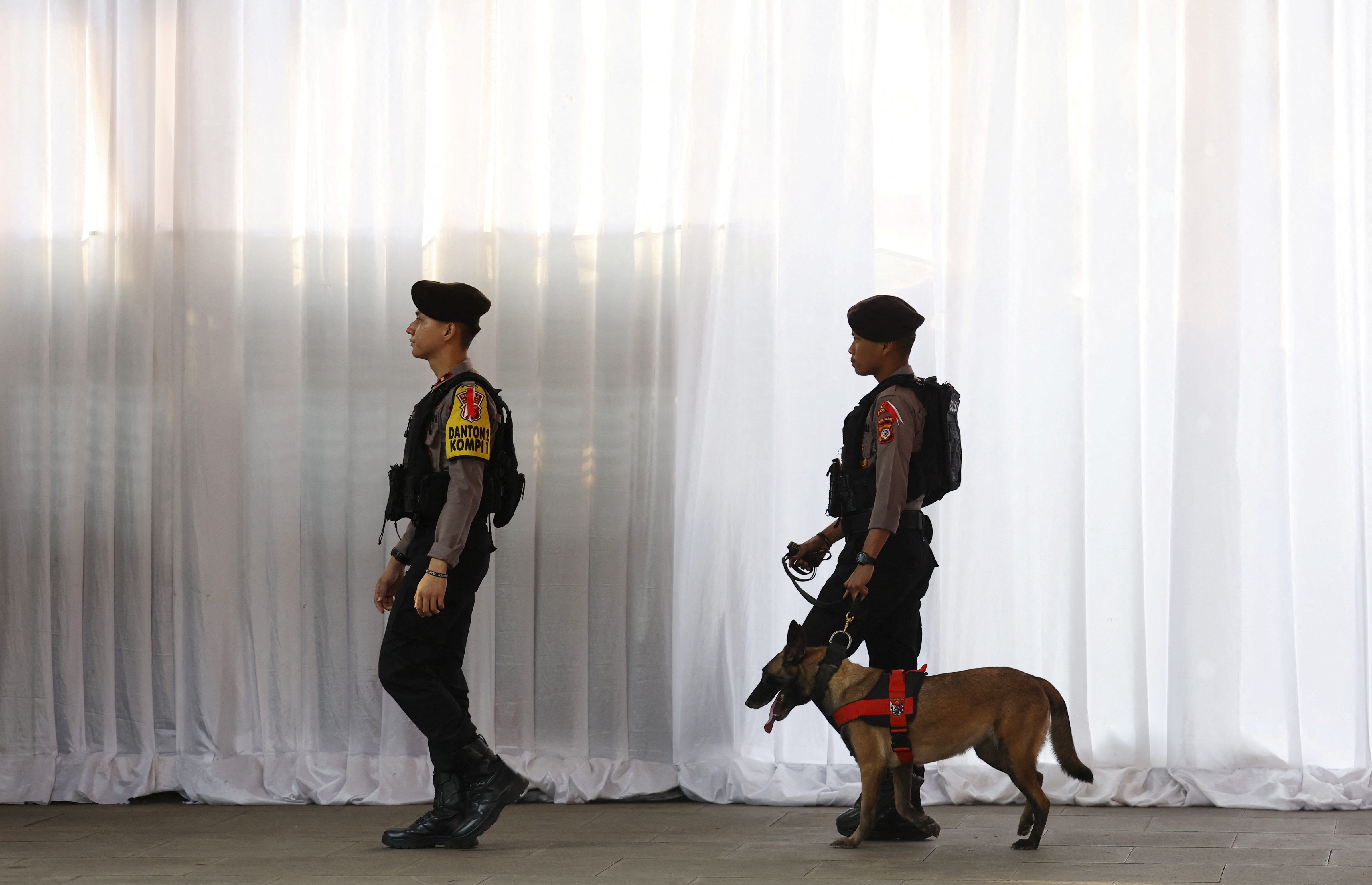 Police officers conduct security checks at the Istiqlal Mosque ahead of Pope Francis' arrival for an interreligious meeting in Jakarta, Indonesia, 05 September 2024.
