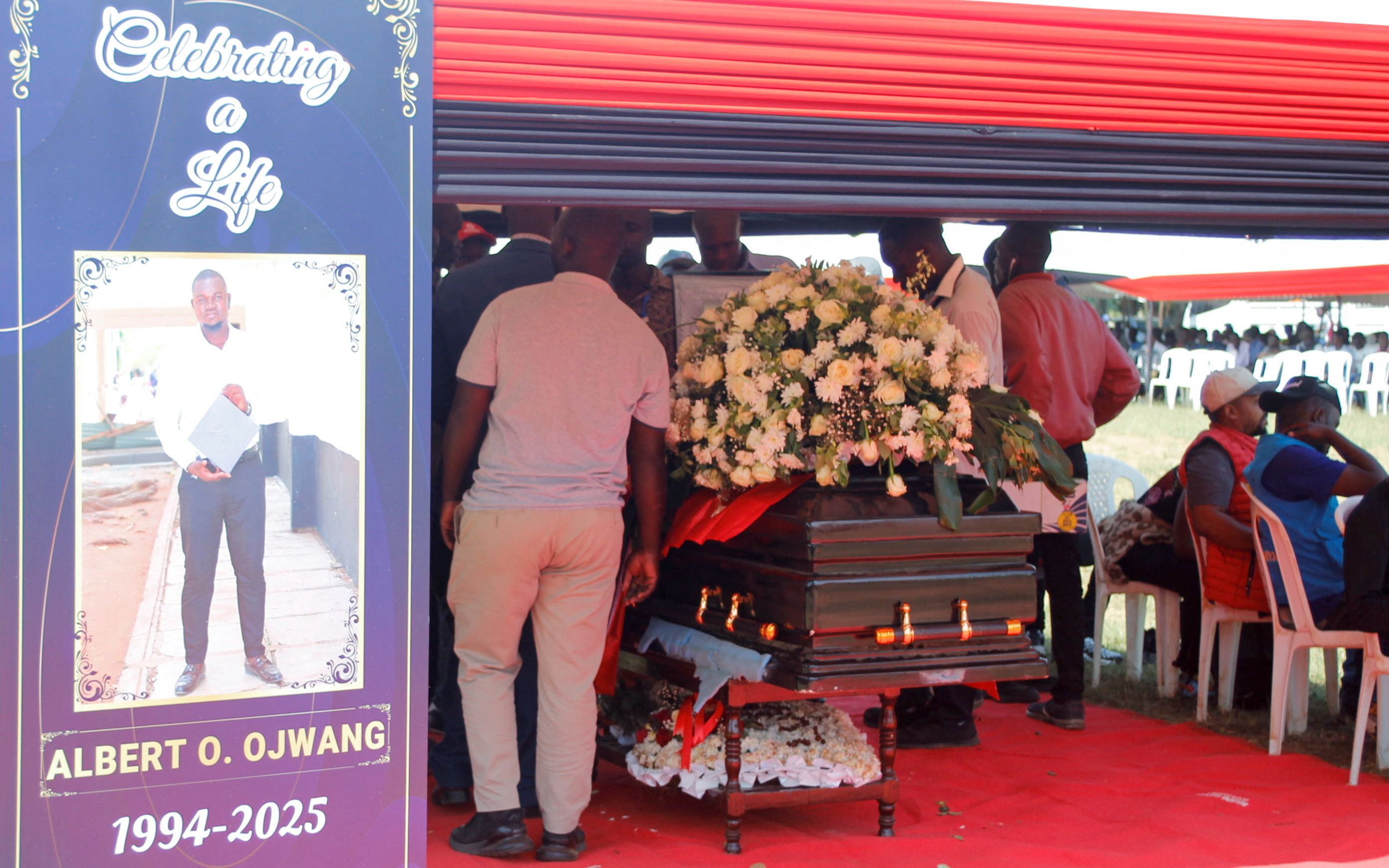 Pallbearers prepare to carry Ojwang’s coffin for burial in Homa Bay, Kenya, on July 4, 2025