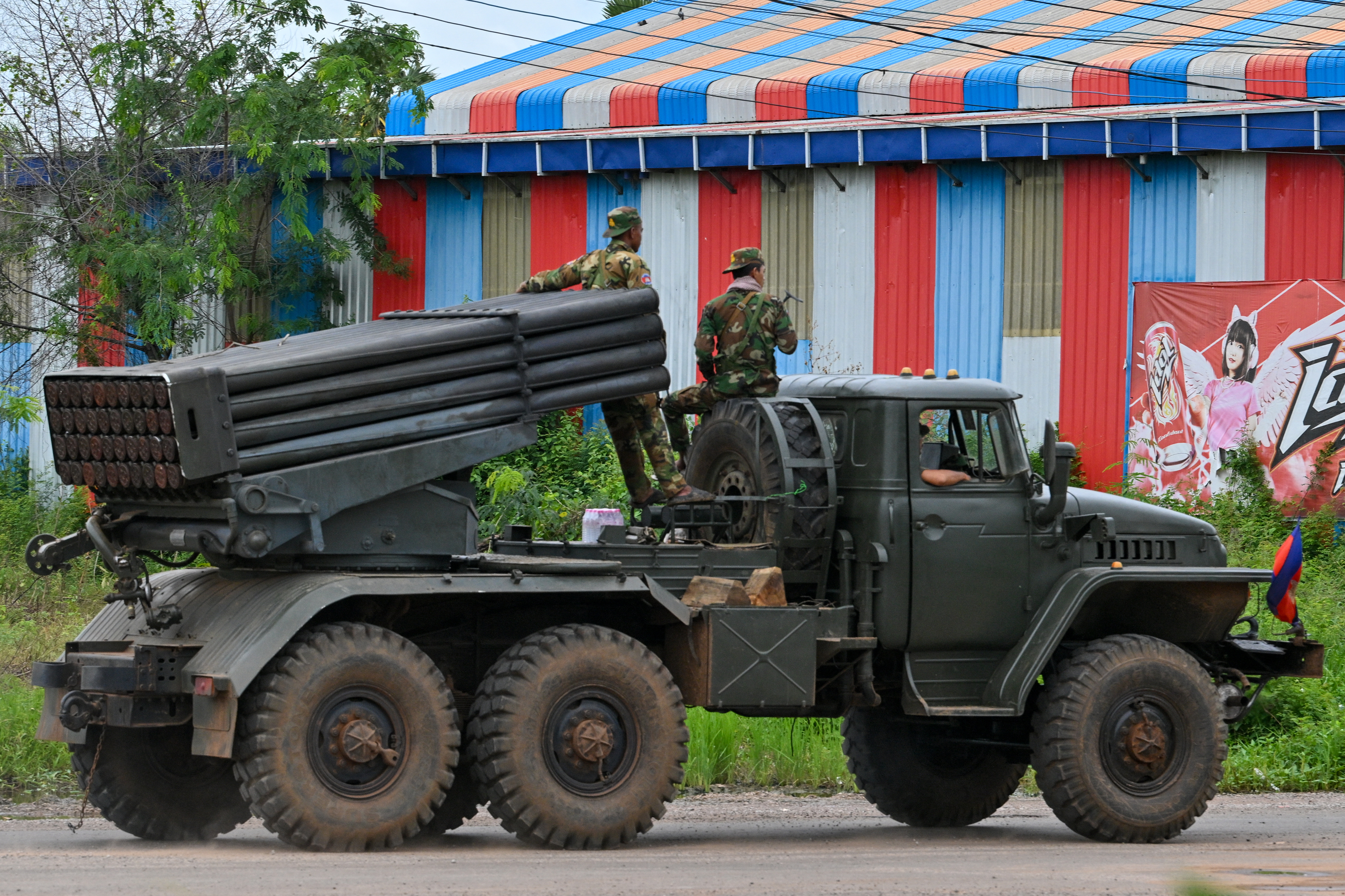 Cambodian soldiers seen on a truck equipped with a Russian-made BM-21 rocket launcher in the northern province of Oddar Meanchey, which borders Thailand, on July 27, 2025