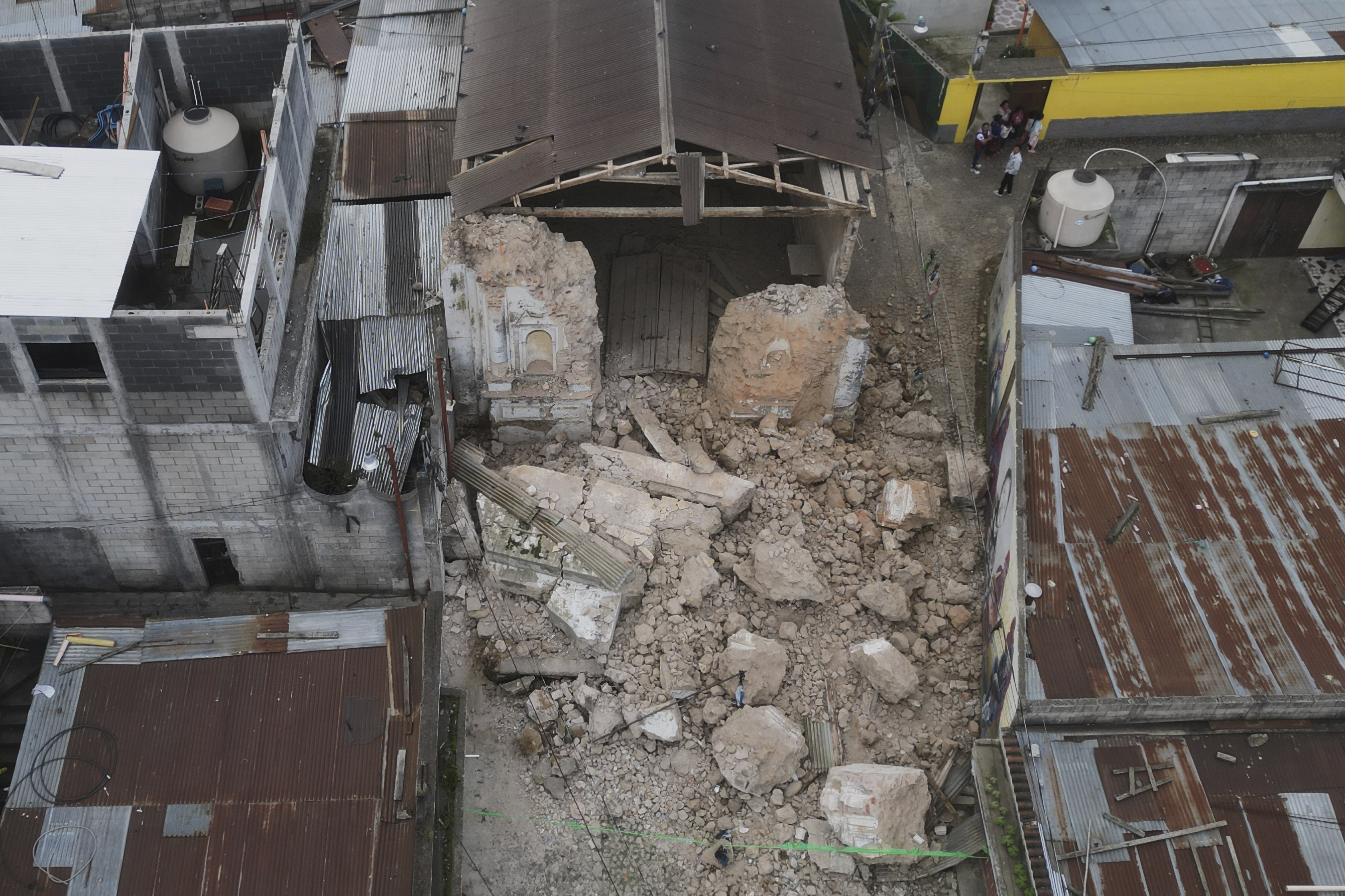 El Calvario Catholic Church lies damaged.
