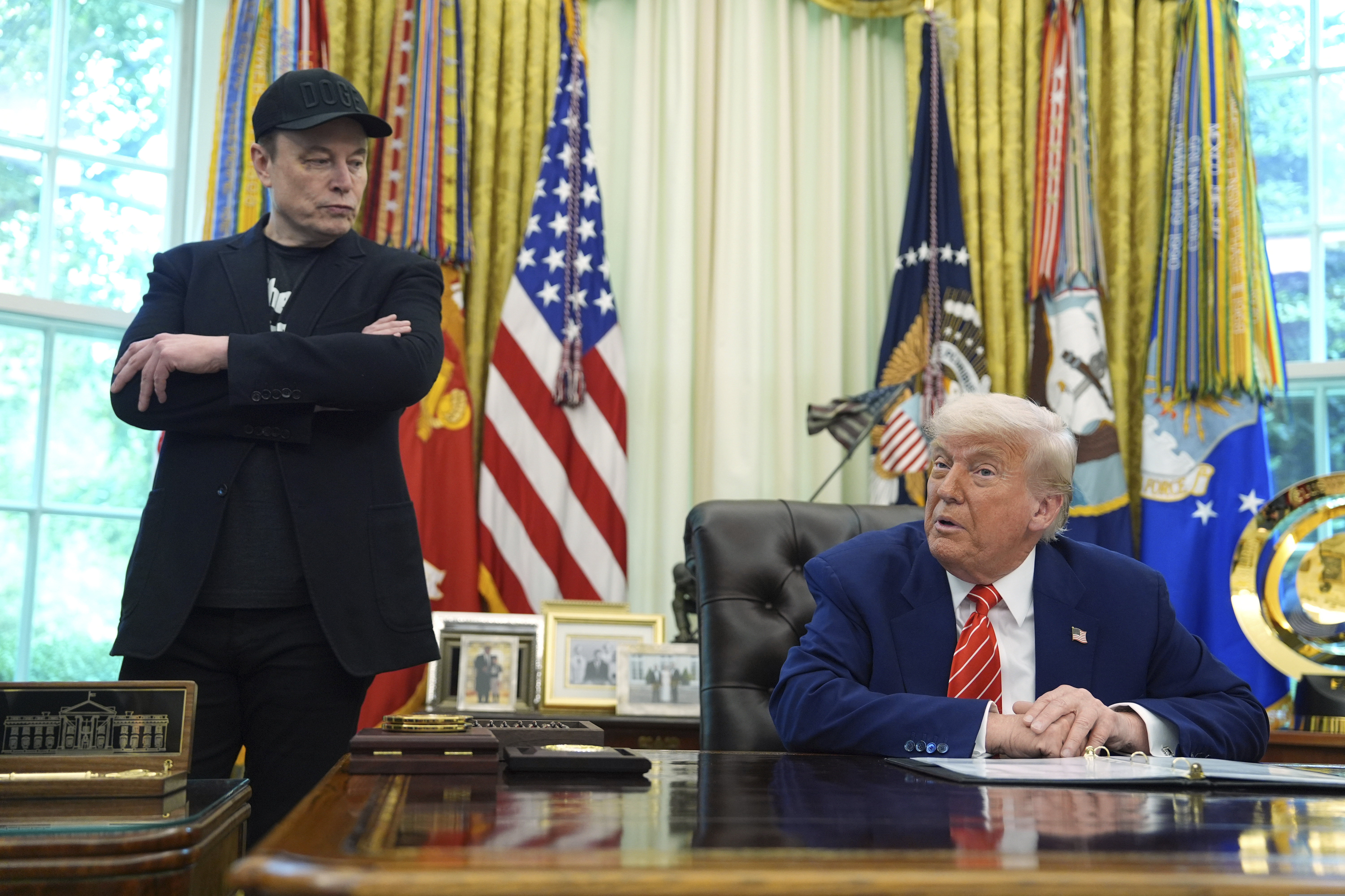 FILE - President Donald Trump, right, speaks during a news conference with Elon Musk in the Oval Office of the White House, in Washington, May 30, 2025,. (AP Photo/Evan Vucci, File)