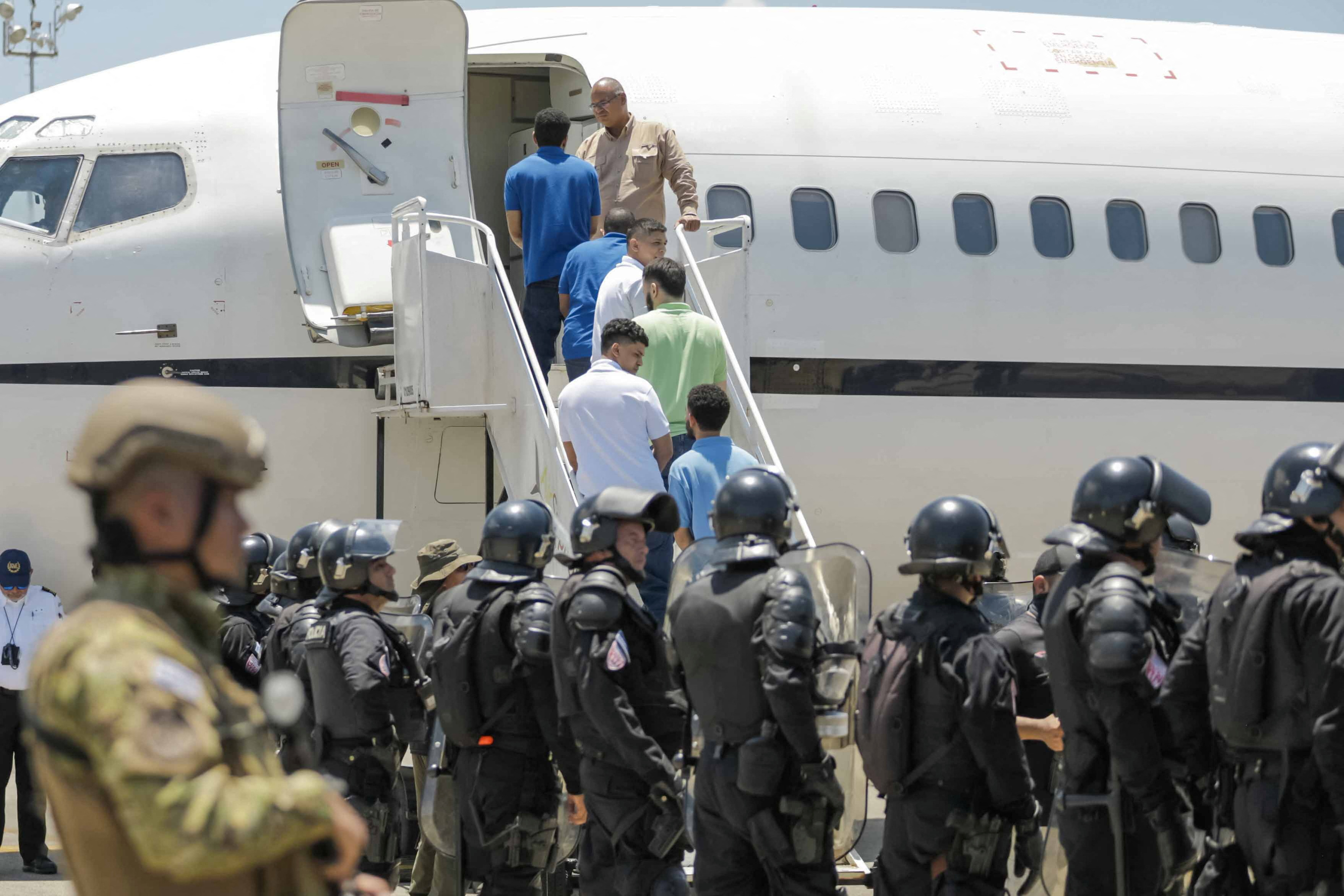 Venezuelan detainees are shown being sent home in a prison exchange for Americans held in Venezuela, according to El Salvador President Nayib Bukele, at El Salvador International Airport on July 18, 2025. The latest State Department report said there were 'no credible reports of significant human rights abuses' in El Salvador [File: El Salvador Government/Handout via Reuters]