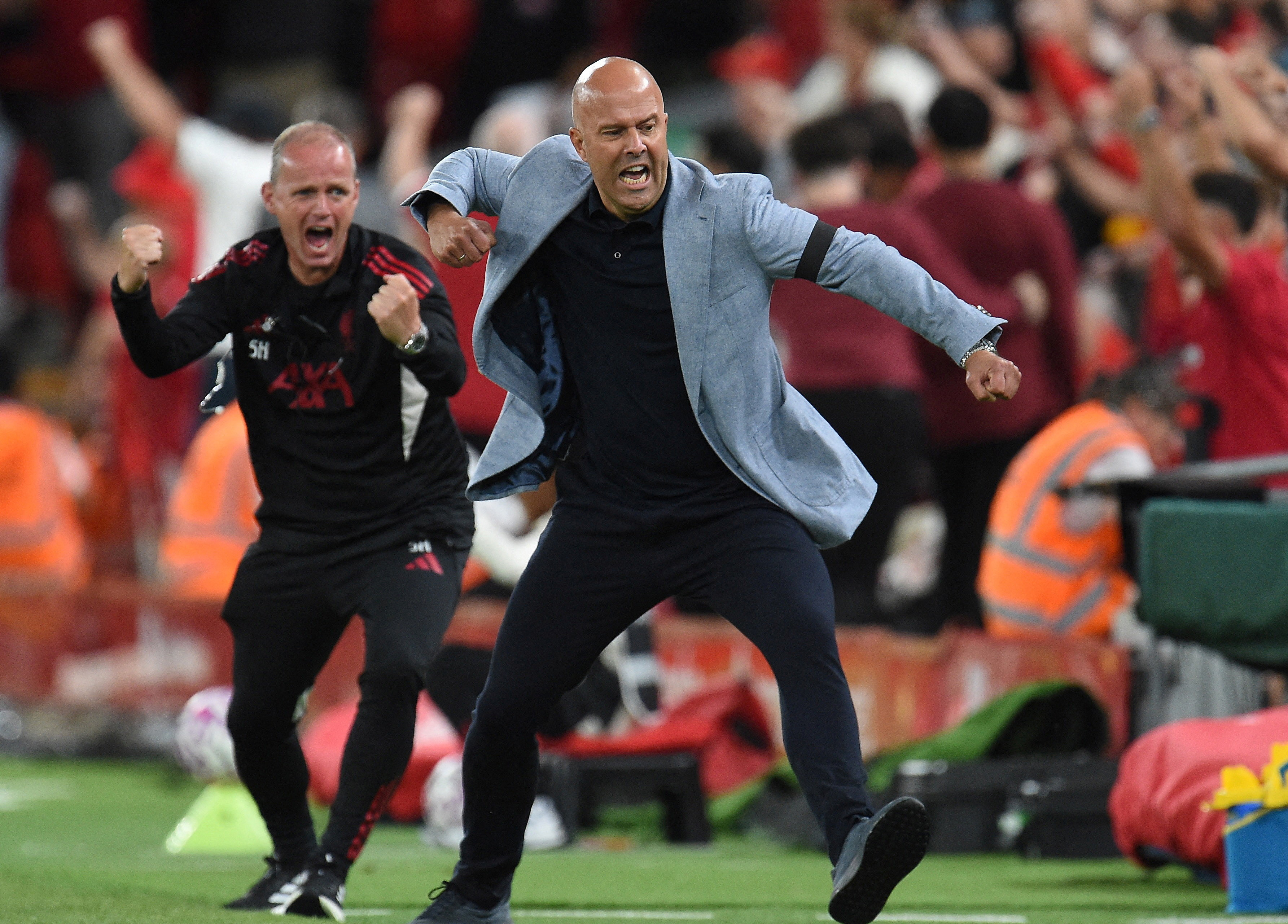 Liverpool manager Arne Slot celebrates their third goal scored by Federico Chiesa