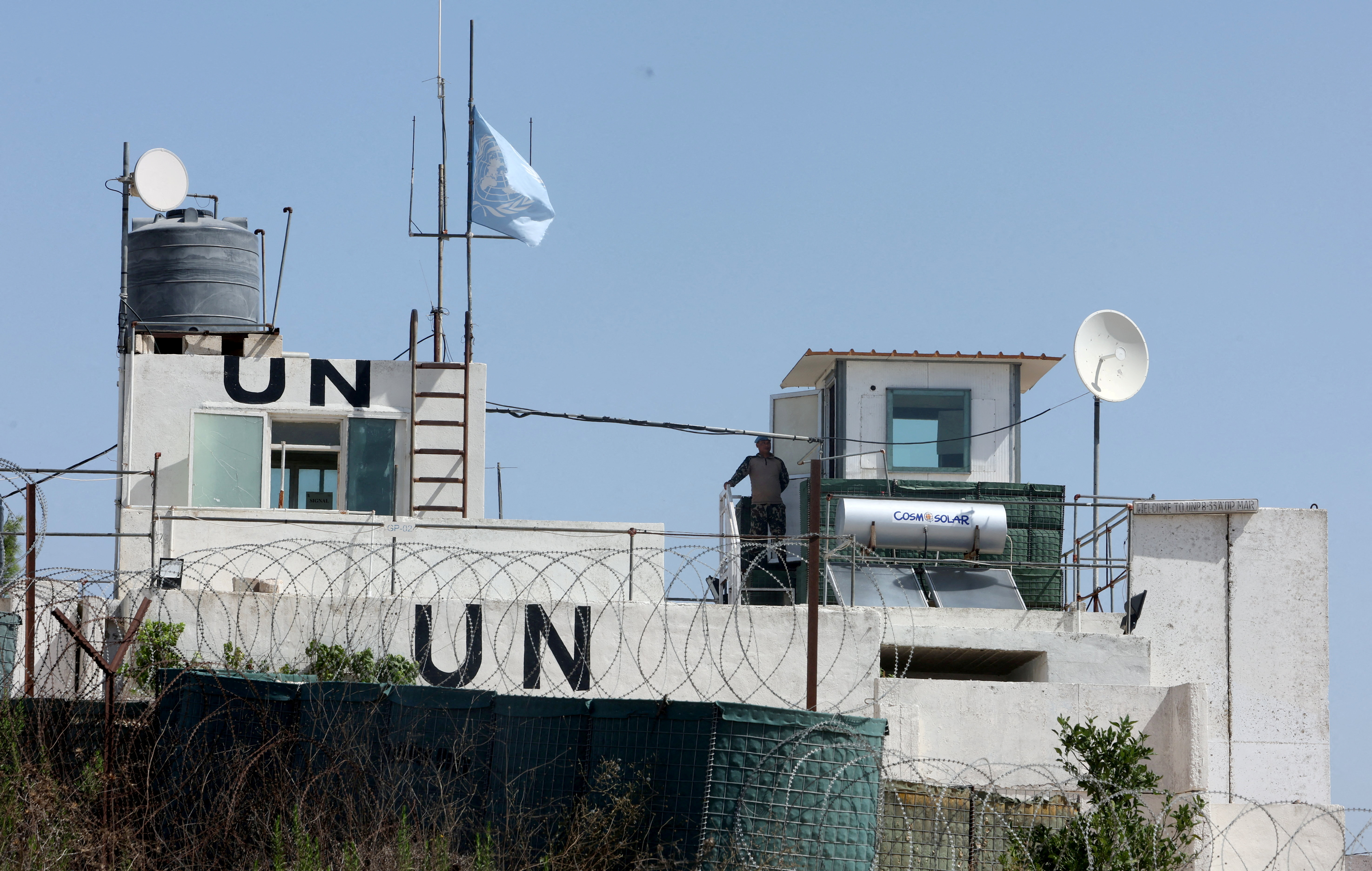 A UN peacekeeper stands at his post.