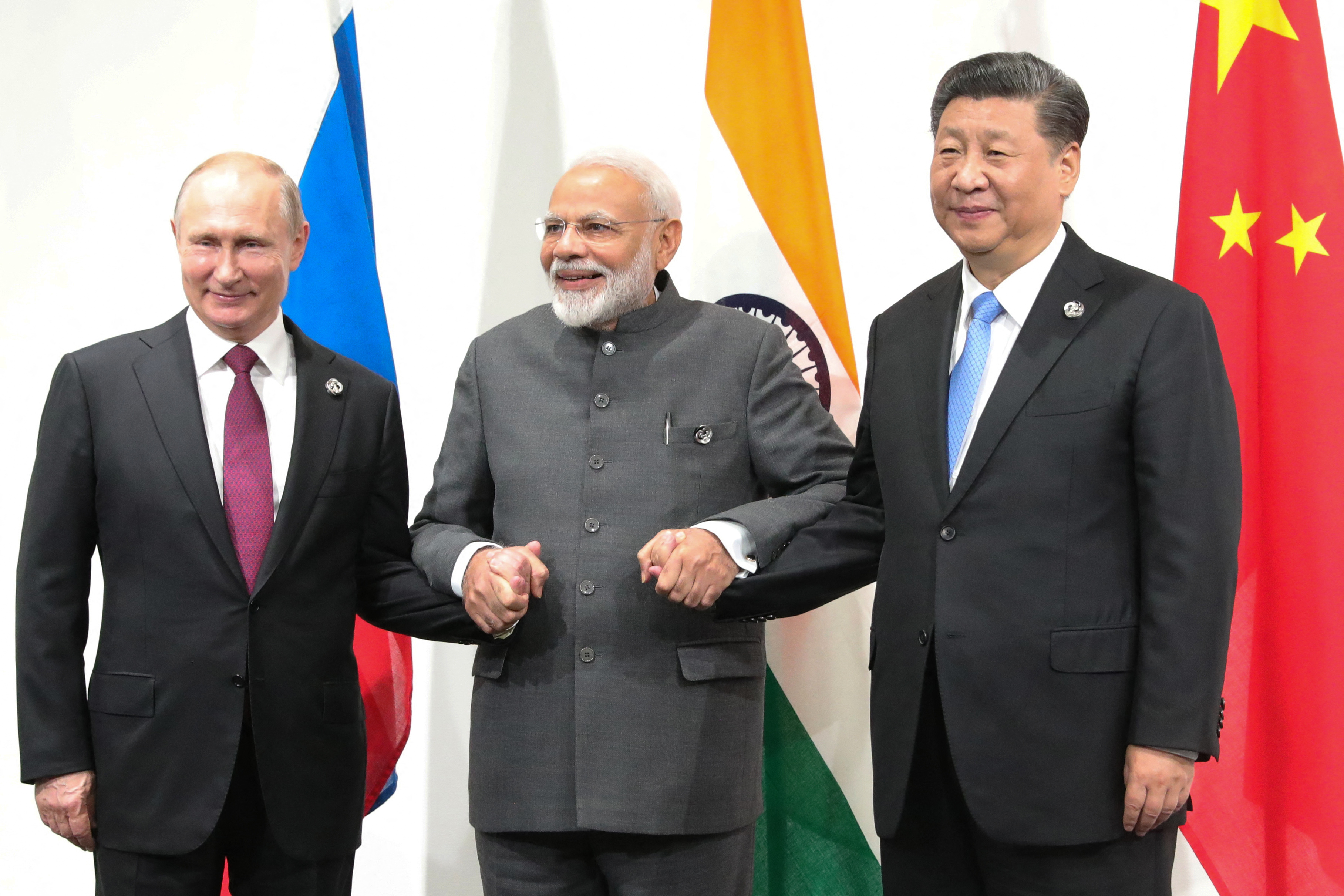 Russian President Vladimir Putin, Indian Prime Minister Narendra Modi and Chinese President Xi Jinping hold a meeting on the sidelines of the G20 summit in Osaka on June 28, 2019