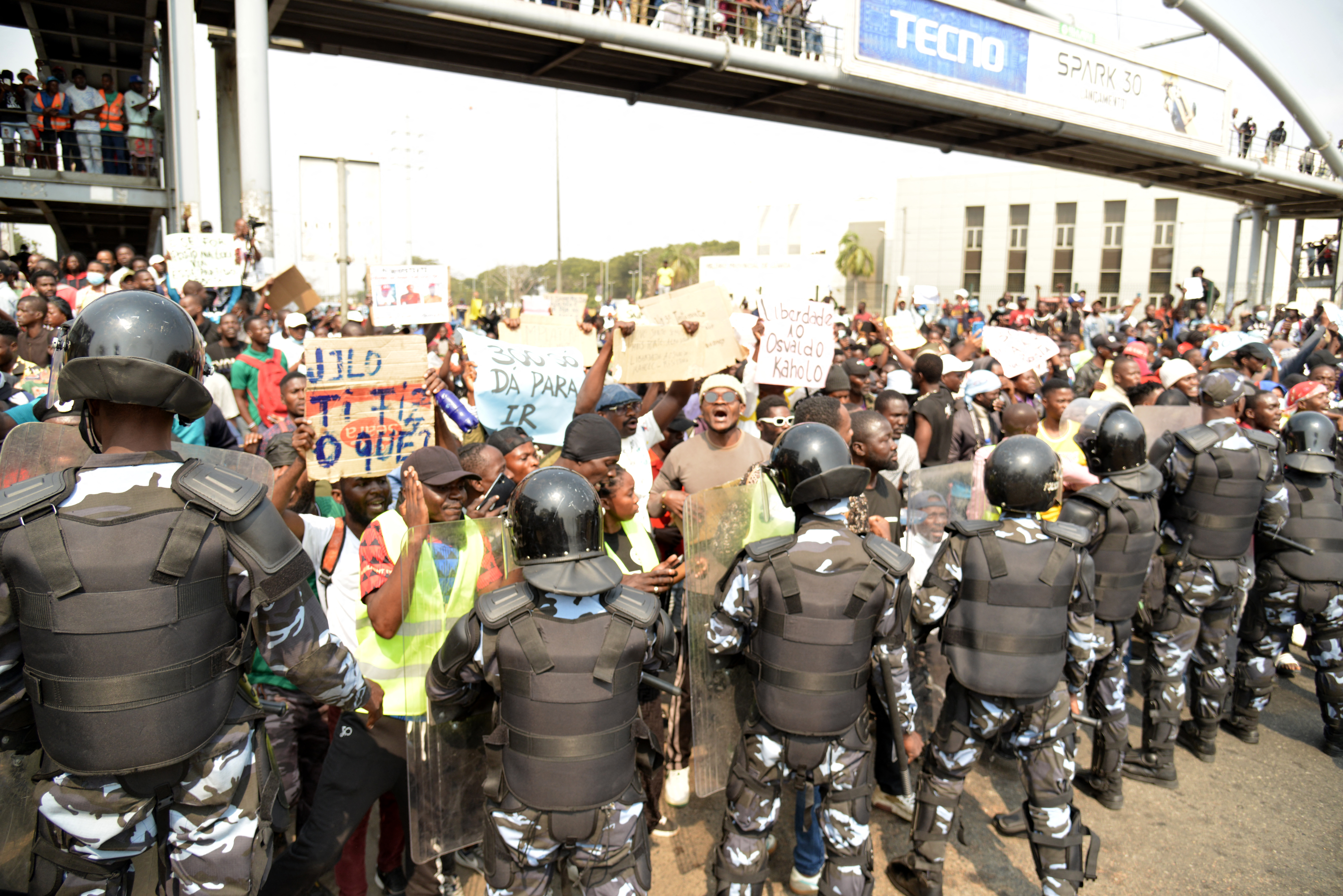 Angolan anti-riot police officers stand in formation as protesters gather in Luanda on July 26 during a protest over high living costs