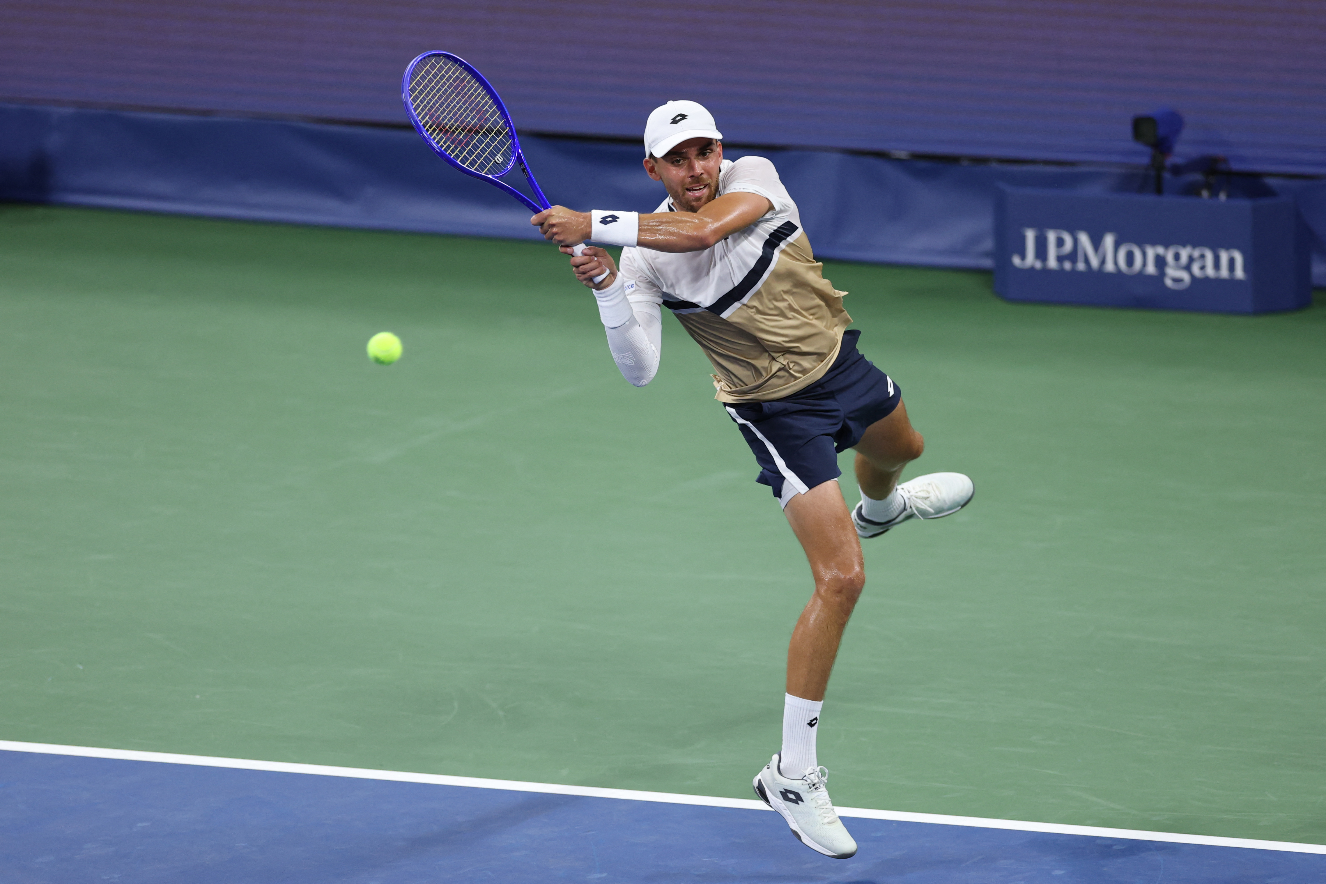France’s Benjamin Bonzi returns the ball to Russia’s Daniil Medvedev during their men’s singles first round tennis match