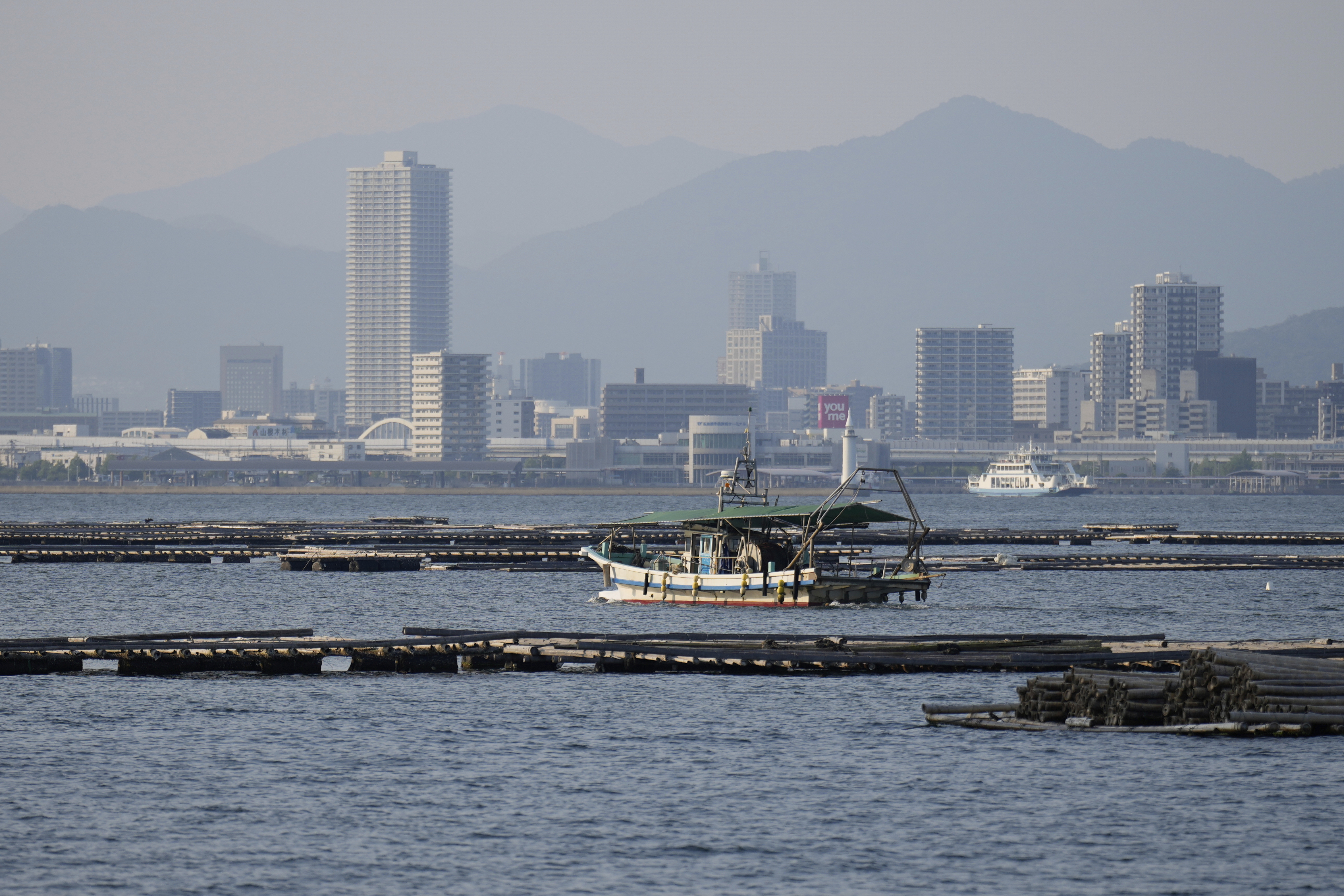 The cityscape of Hiroshima as seen from Ninoshima, an island where thousands of the dead and dying were brought after the first atomic bomb detonated 80 years ago
