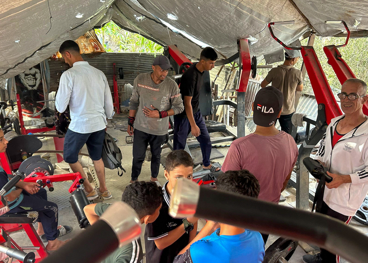 Al-Assar, far right, restricts the bodybuilders’ workouts to no more than 30 minutes due to fatigue, muscle cramping and the chronic lack of food available for post-workout recovery