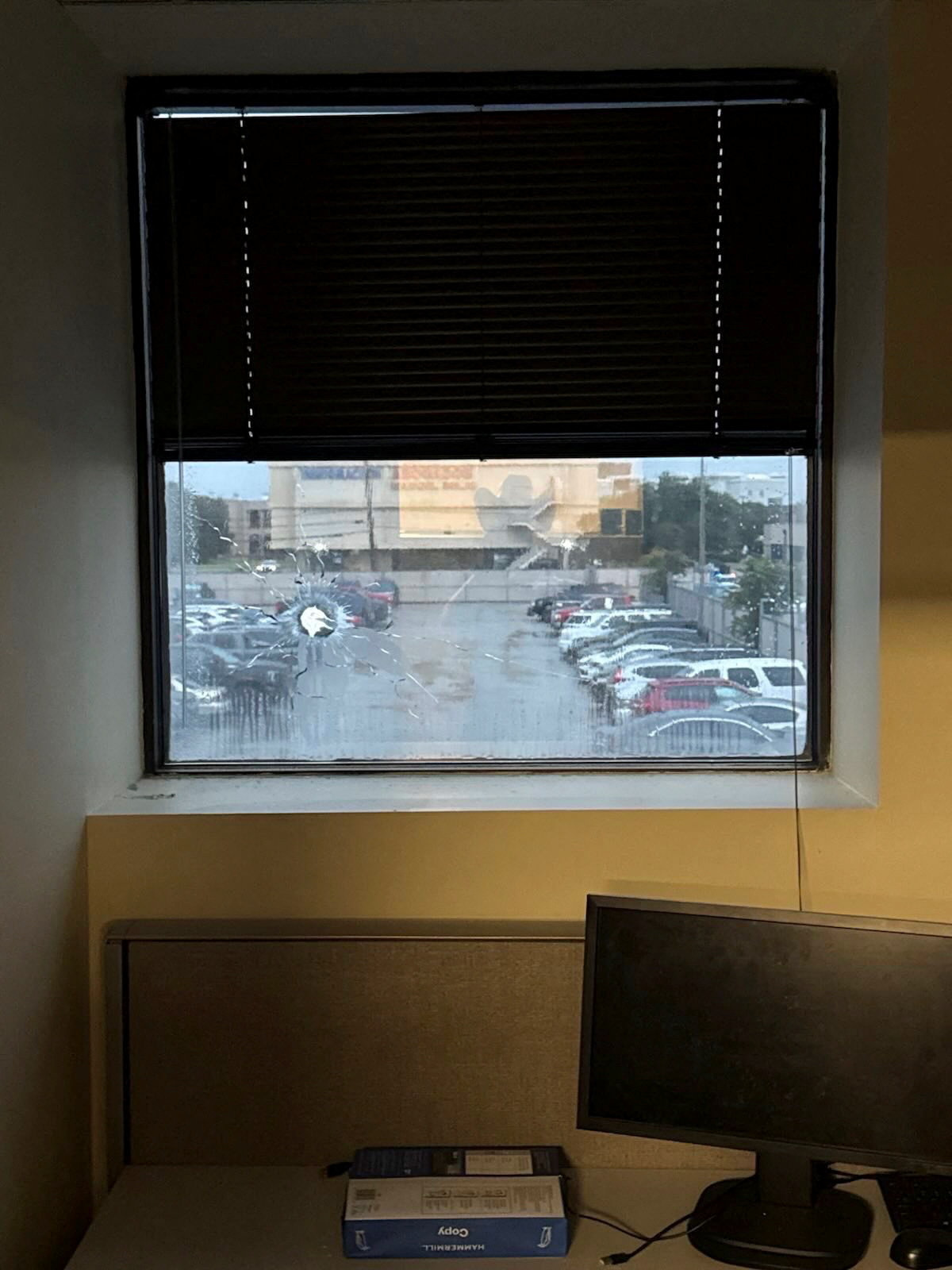 A broken window is seen in this picture released on social media by Assistant Secretary for Public Affairs Tricia McLaughlin [@TriciaOhio via Reuters]