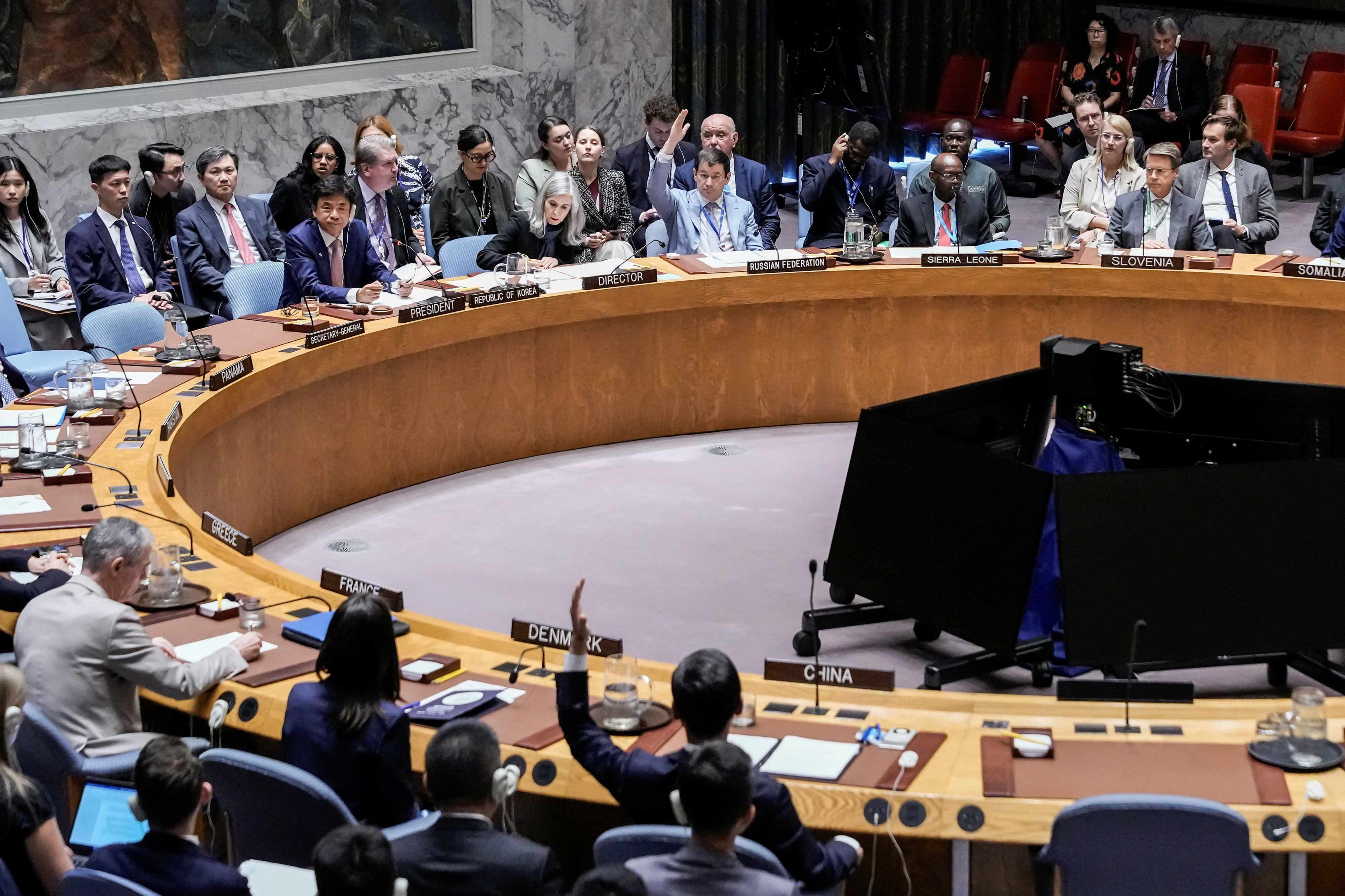 Members of the United Nations Security Council vote.