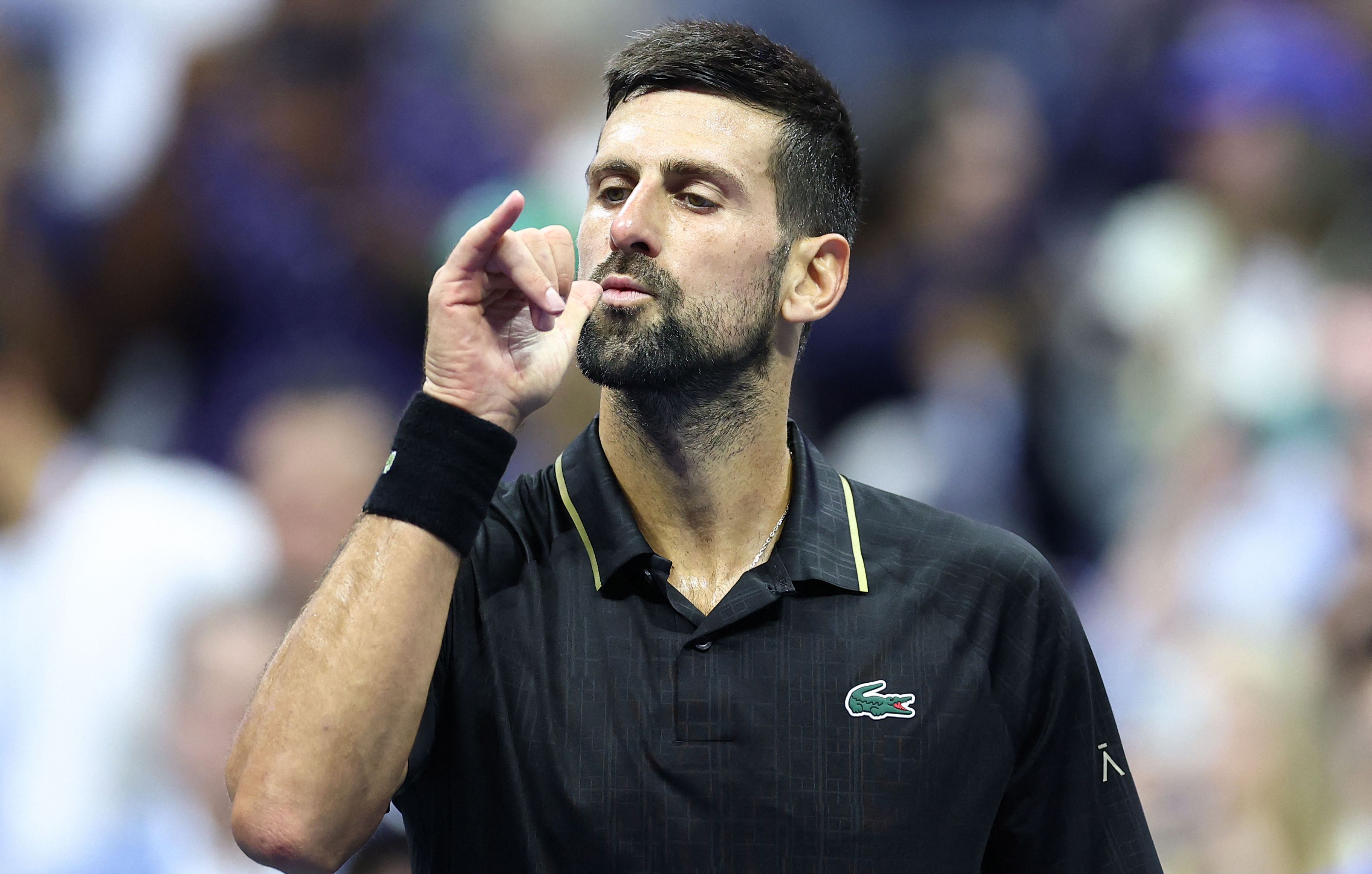 Novak Djokovic reacts.