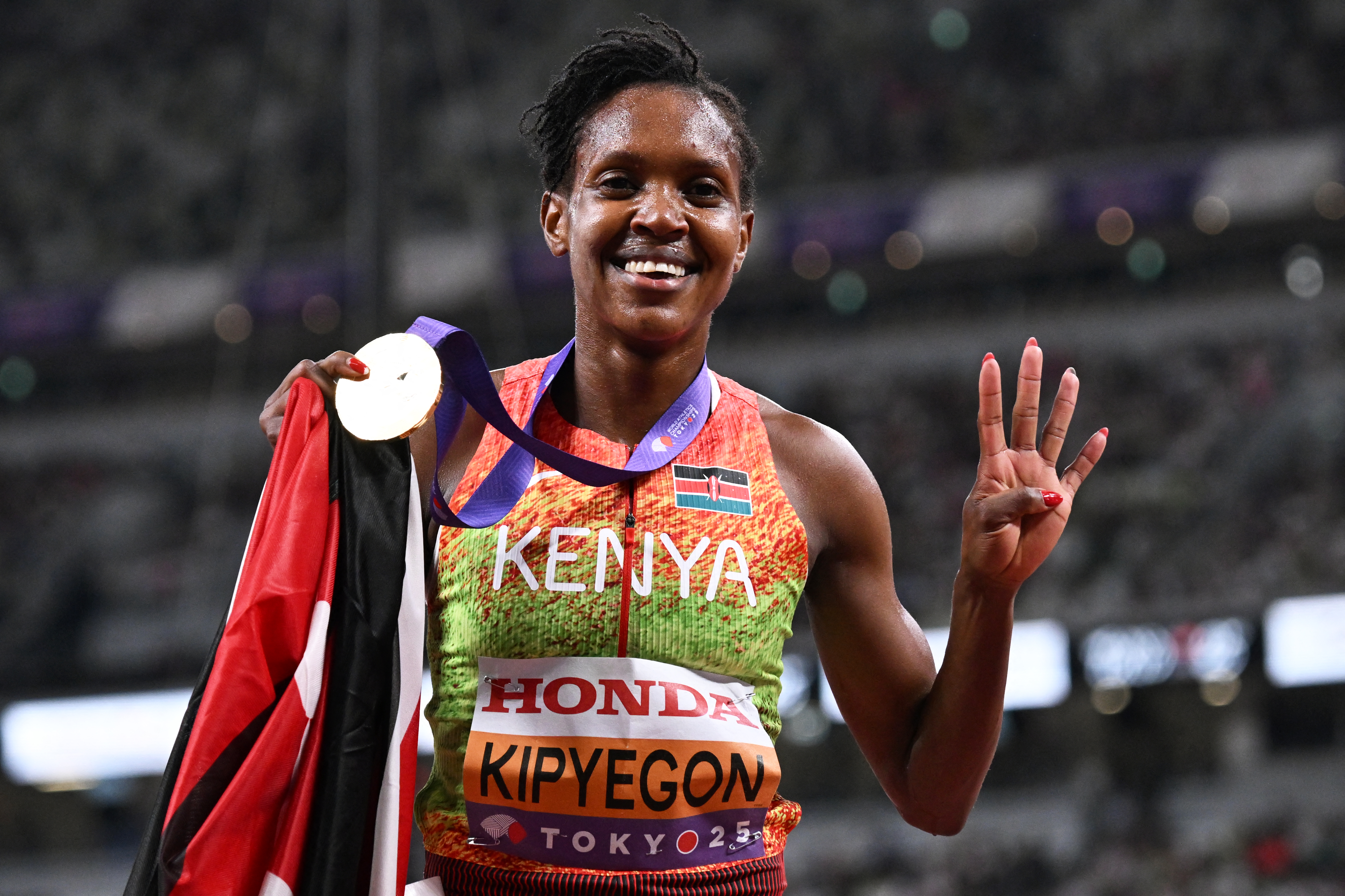 Kenya's Faith Kipyegon celebrates after winning the women's 1500m final during the World Athletics Championships in Tokyo on September 16, 2025. (Photo by Jewel SAMAD / AFP)