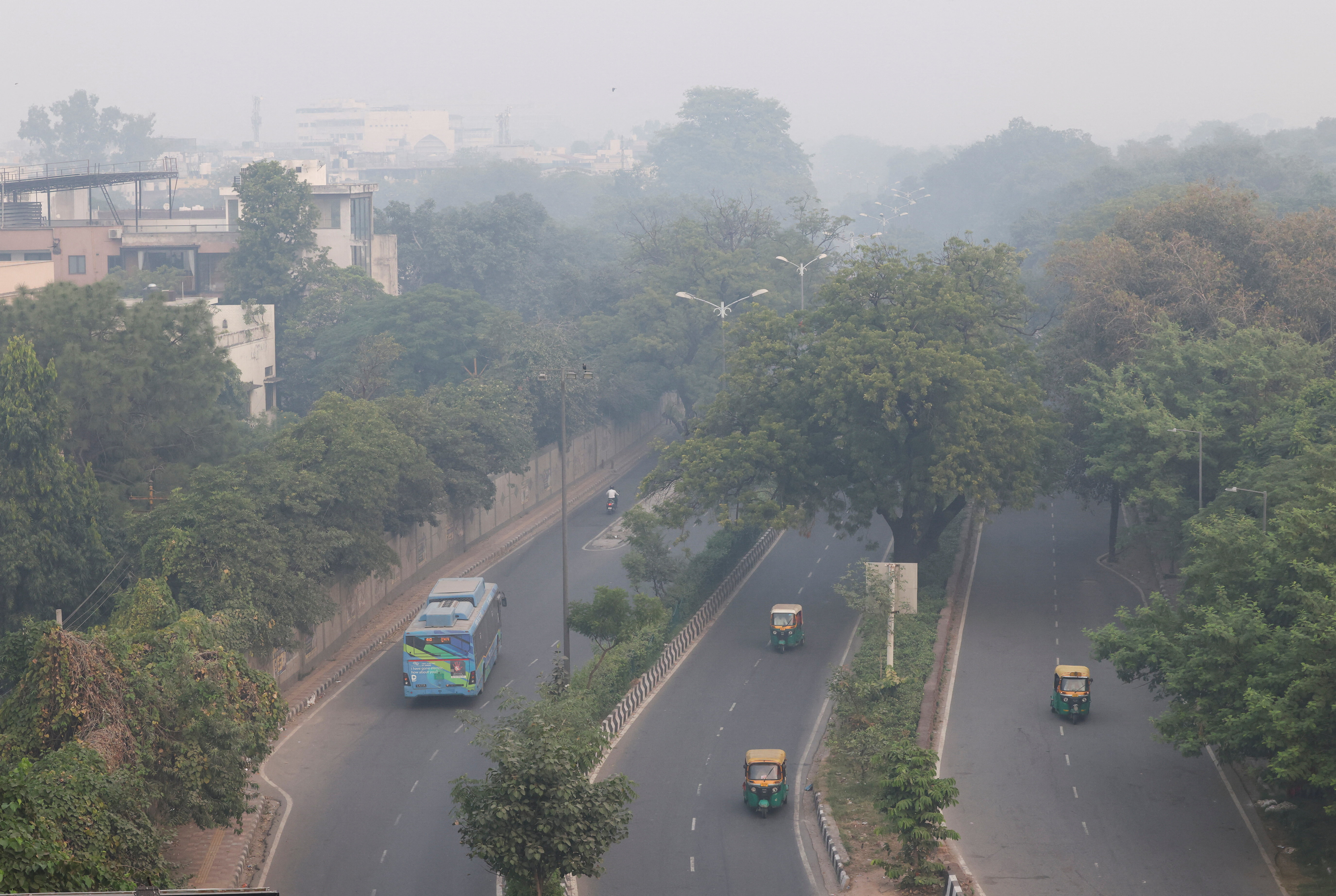 Vehicles move on a road shrouded in smog on the day after Diwali, the Hindu festival of lights, in New Delhi, India, October 21, 2025. REUTERS/Bhawika Chhabra