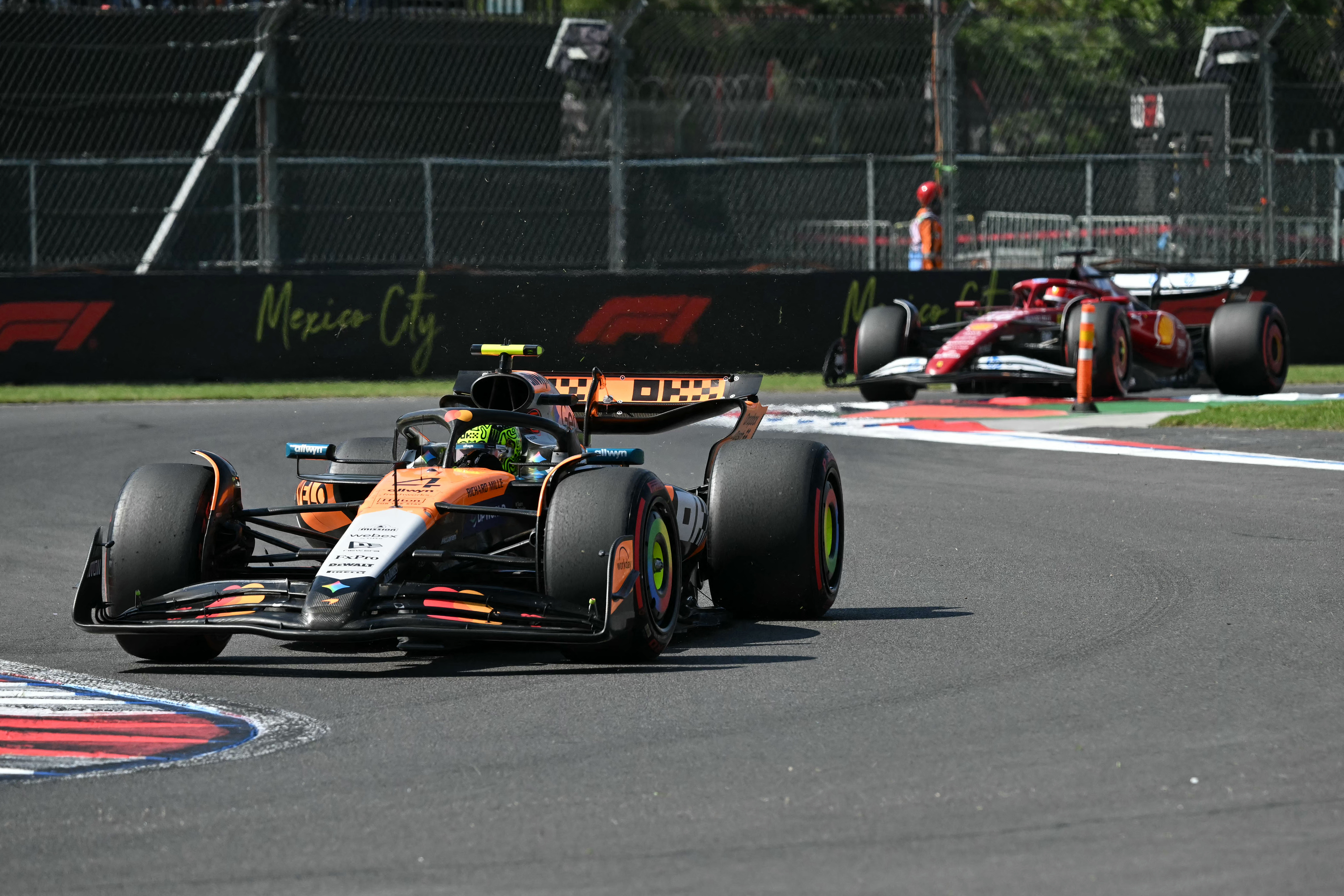 McLaren’s Lando Norris races in the lead, ahead of Ferrari driver Charles Leclerc, during the Mexico City Formula One Grand Prix