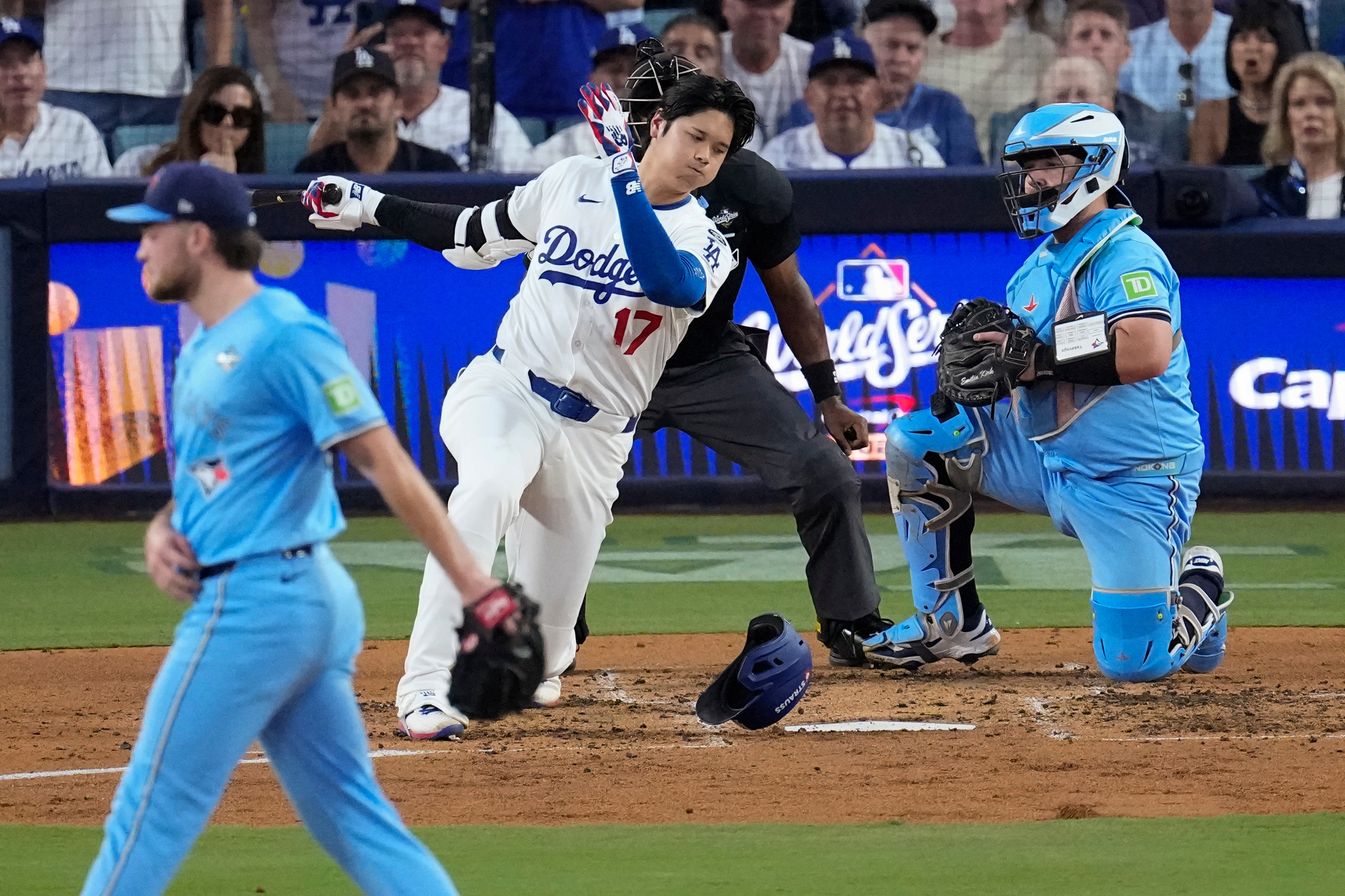 Los Angeles Dodgers’ Shohei Ohtani #17 loses his helmet after striking out against Yesavage, left, during the third inning in Game 5