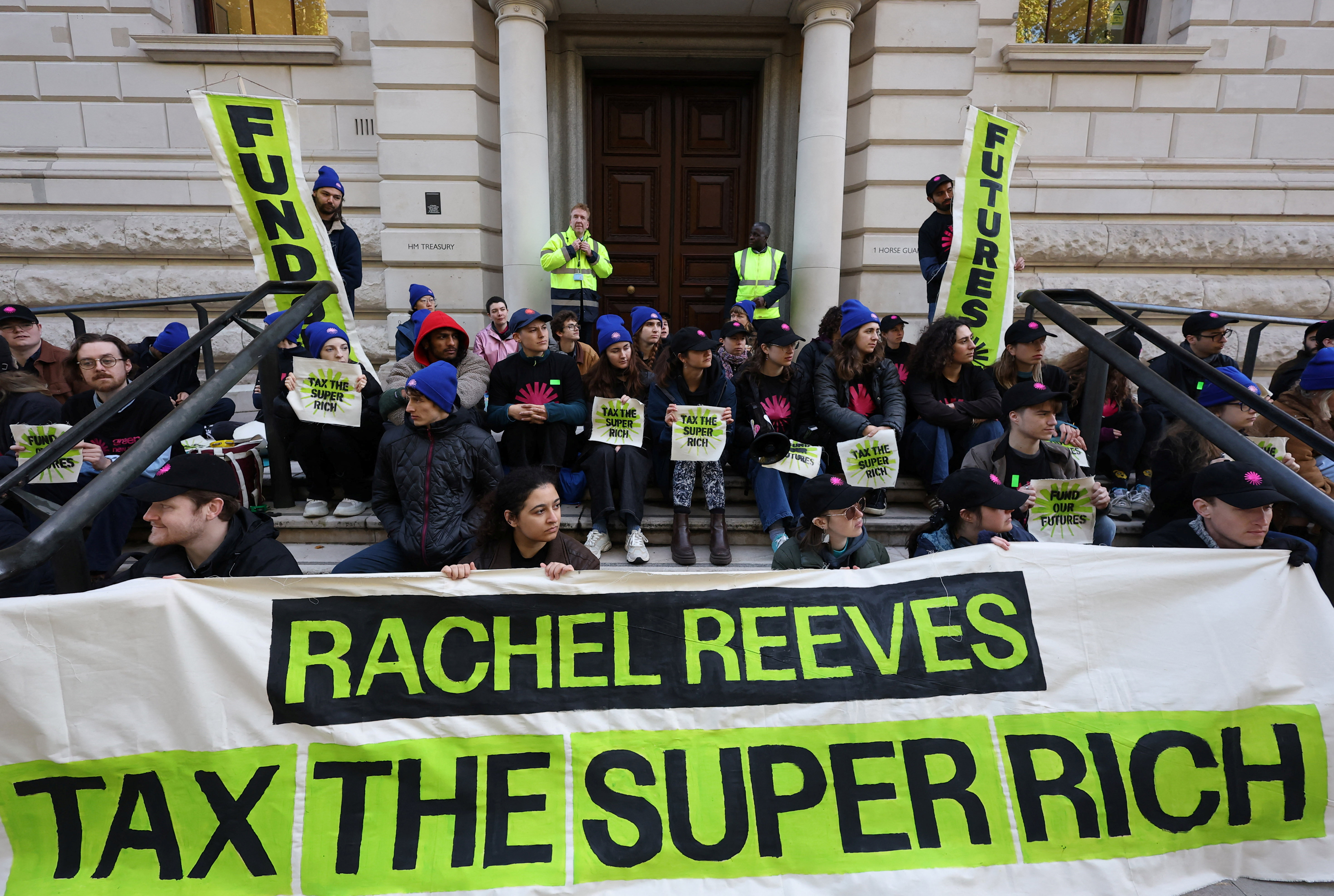 Young climate activists from Green New Deal Rising protest outside the British government Treasury building, demanding wealth taxes on the super-rich, ahead of the upcoming Budget by British finance minister Rachel Reeves, London, Britain, October 27, 2025. REUTERS/Toby Melville