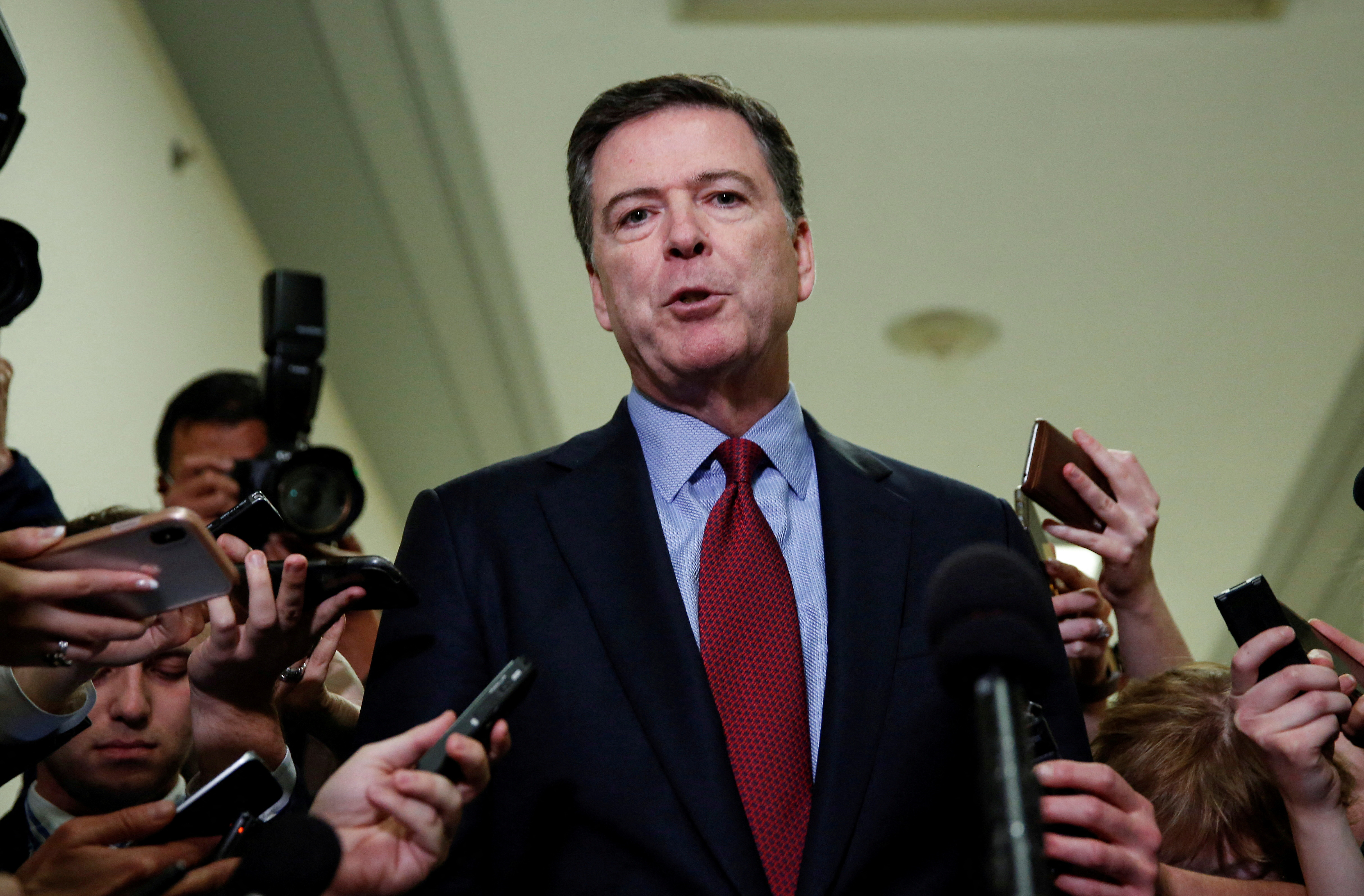 James Comey in a media scrum