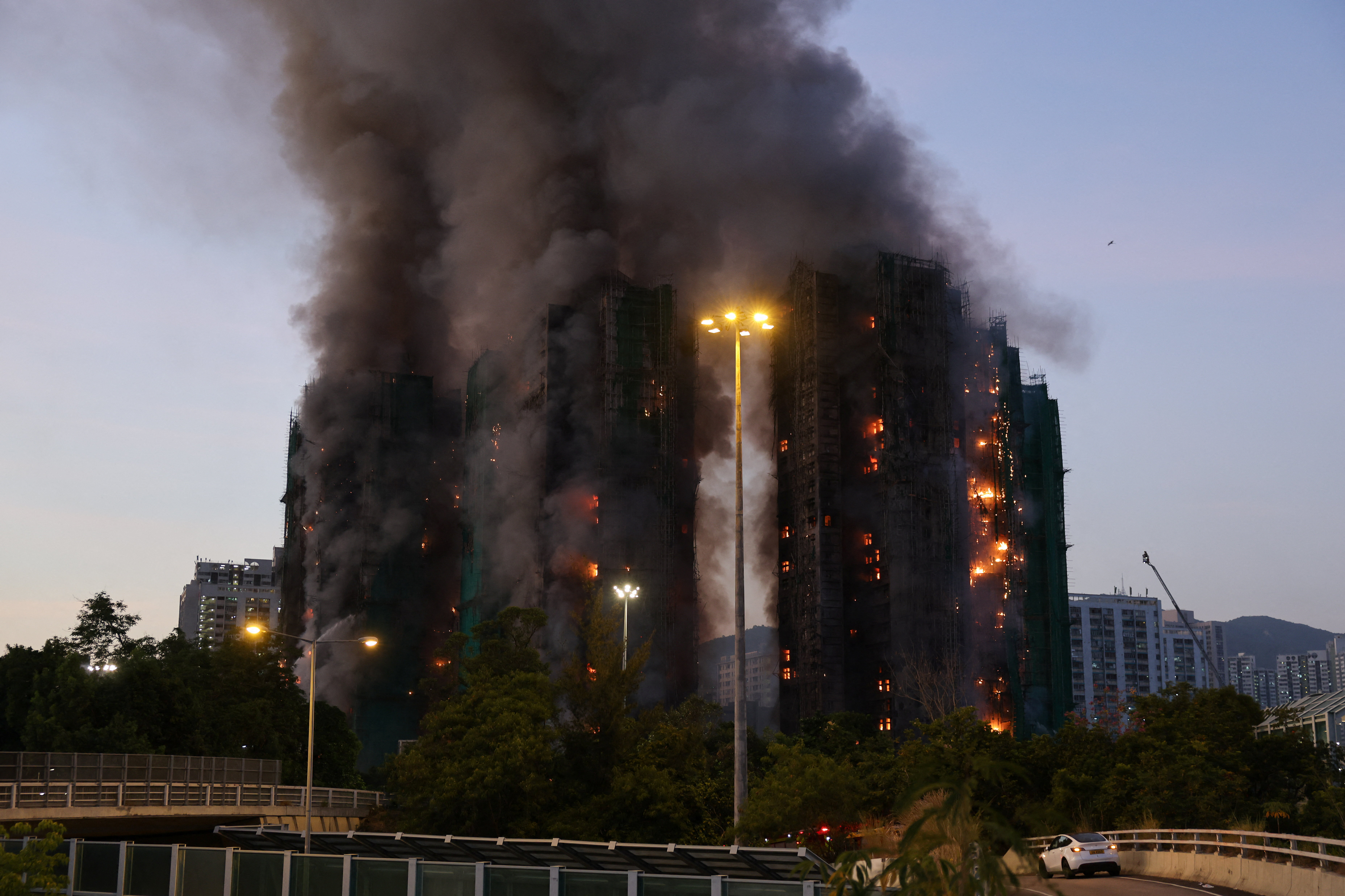 Fire burns bamboo scaffolding across multiple buildings at Wang Fuk Court housing estate