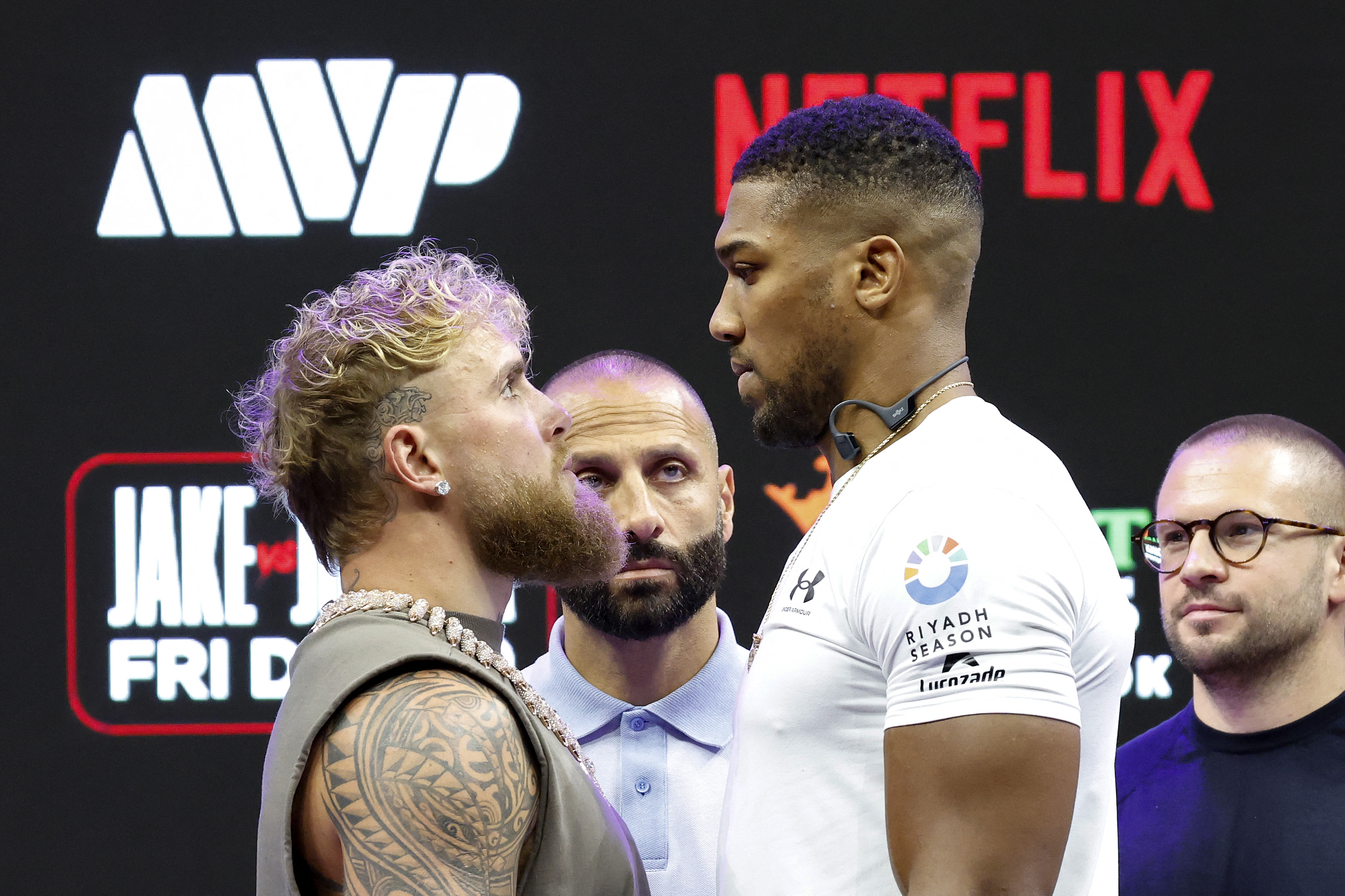 Jake Paul and Anthony Joshua react.