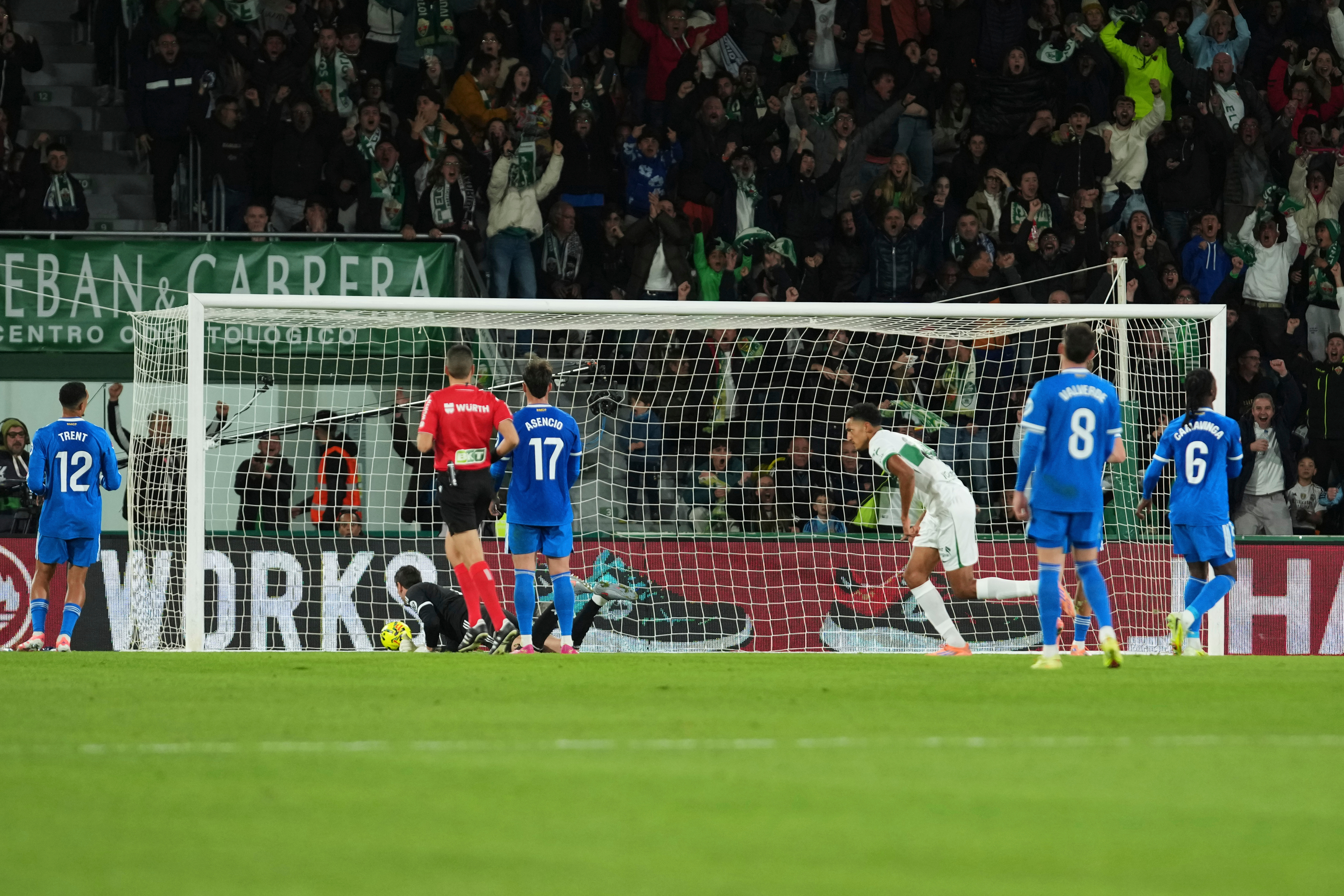 Forward Alvaro Rodriguez, third from right, scores his team’s second goal in the 84th minute to put Elche ahead of Real Madrid 2-1