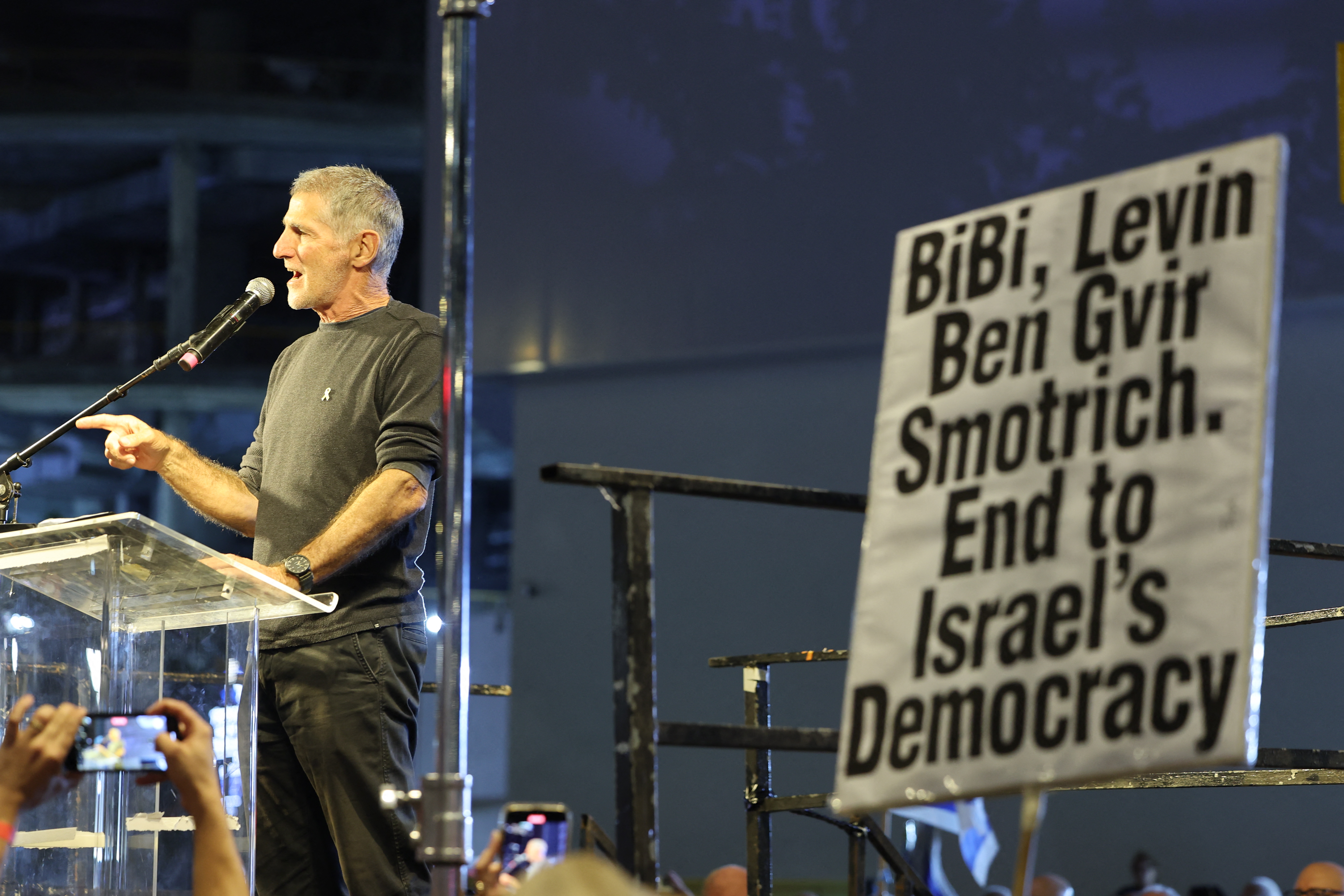 Yair Golan, head of the left-wing Democrats party, addresses Israeli anti-government protesters during a demonstration against Prime Minister Benjamin Netanyahu and demand the establishment of a state commission of inquiry into the events of October 7, in the Israeli coastal city of Tel Aviv on November 8, 2025.