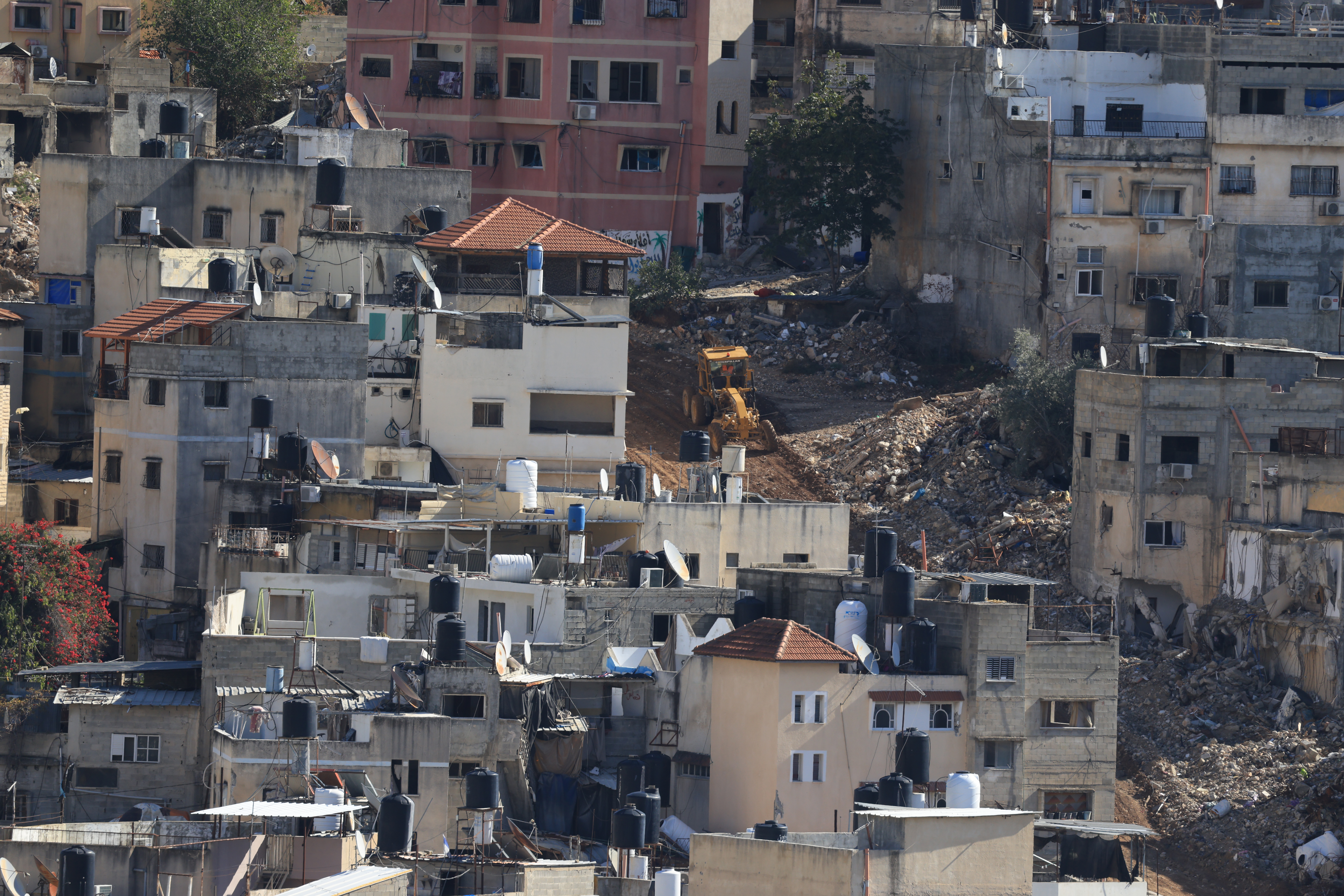 Israeli bulldozer open streets during a military operation at Nur Shams refugee camp near the West Bank city of Tulkarem, 26 November 2025. According to the Palestinian news agency Wafa, Israeli forces continued their military operation in the city of Tulkarem and the two camps for the 304th consecutive day. EPA/ALAA BADARNEH