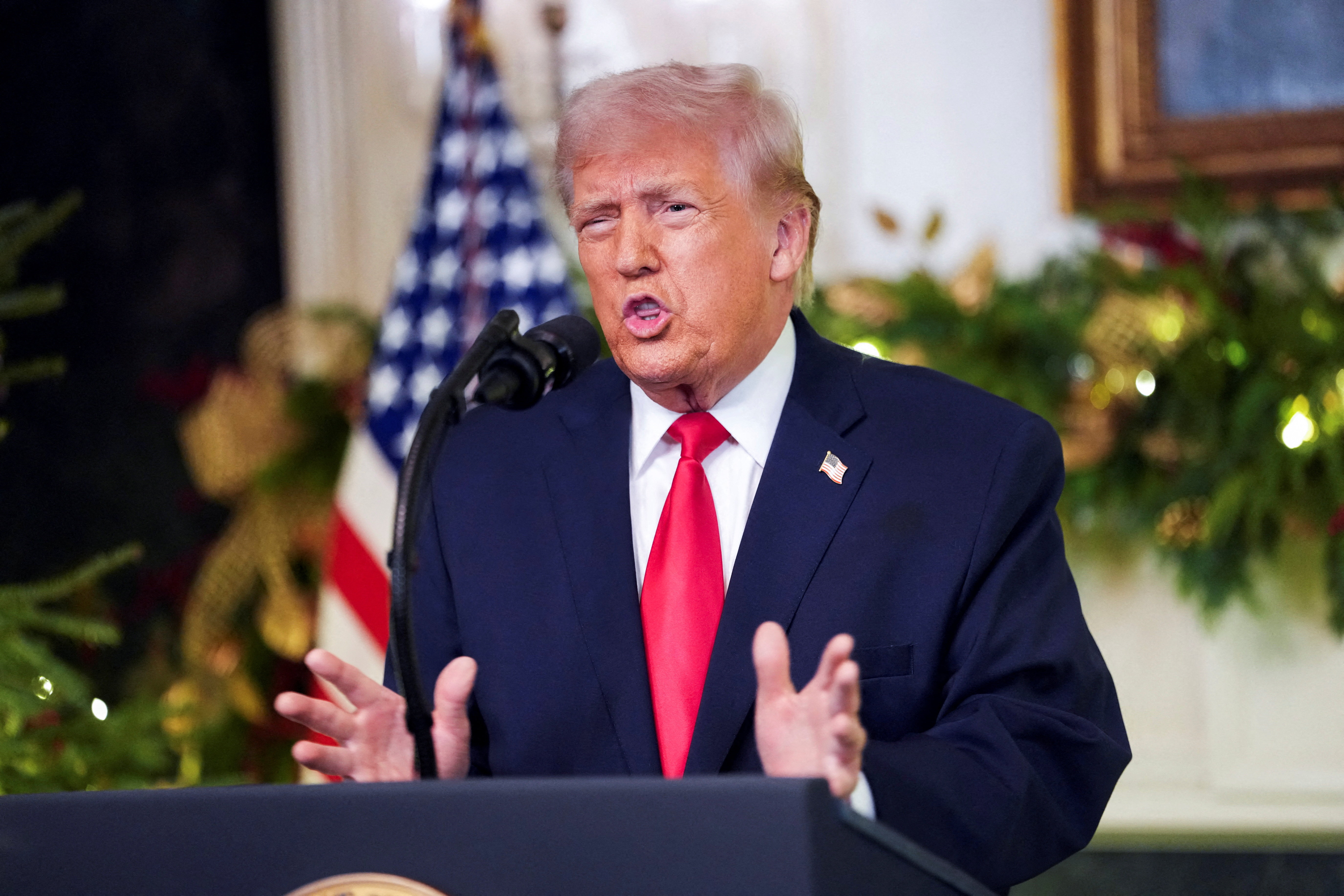 US President Donald Trump speaks at a podium.
