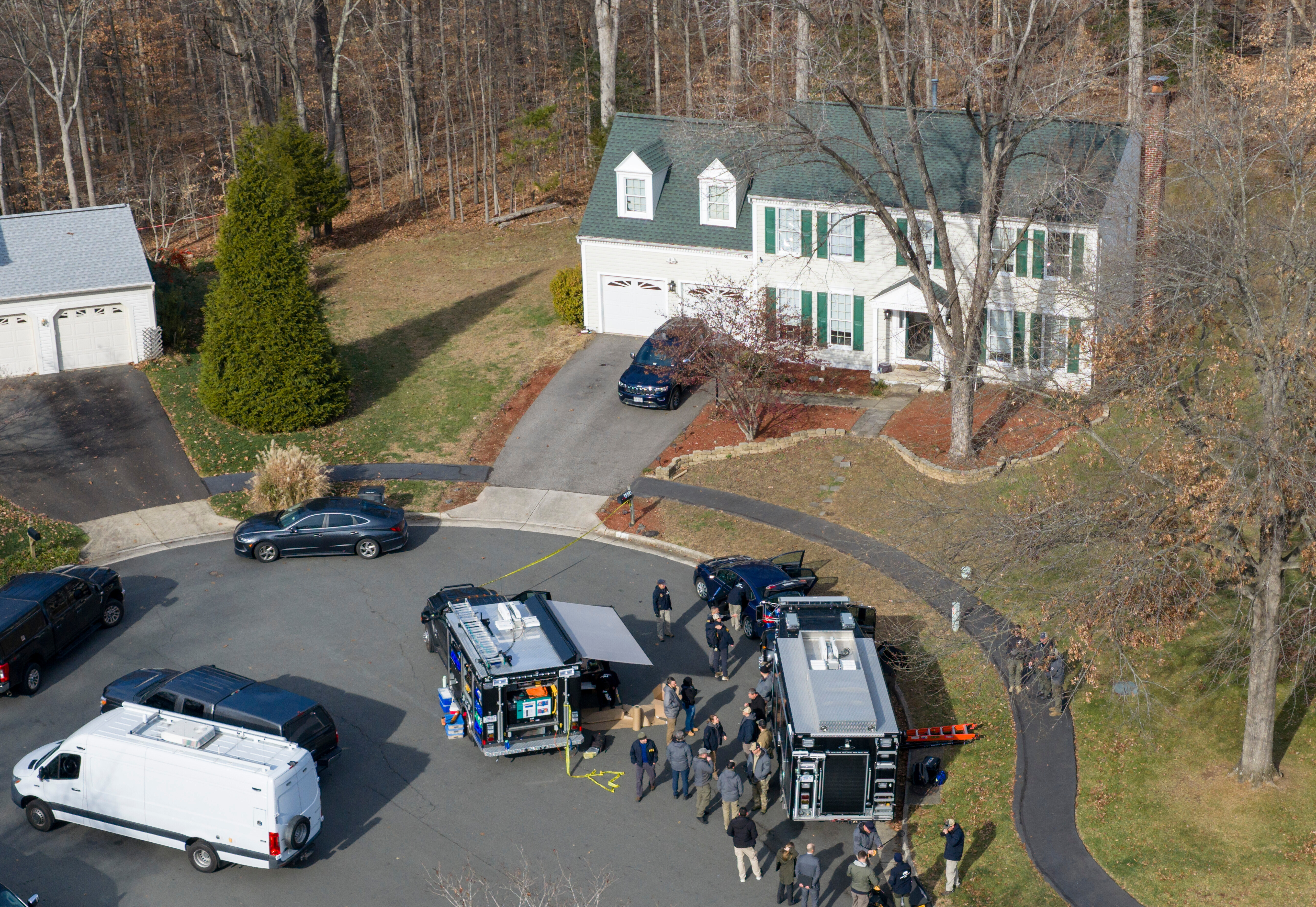 Prince William County Police block the street near a house in Woodbridge, Virginia, on December 4, when the FBI made an arrest in the pipe bomb case