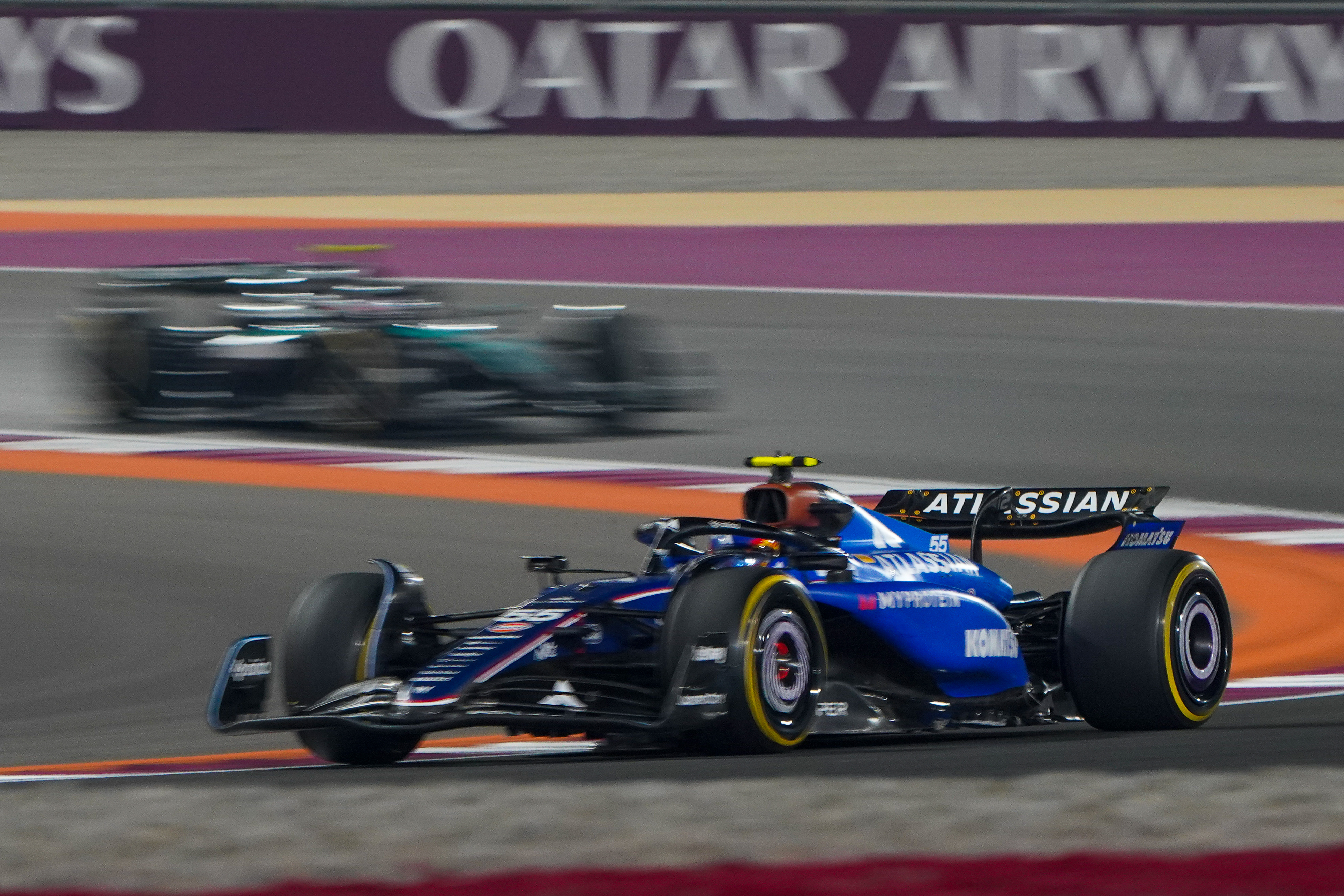 Racing car is seen on track.