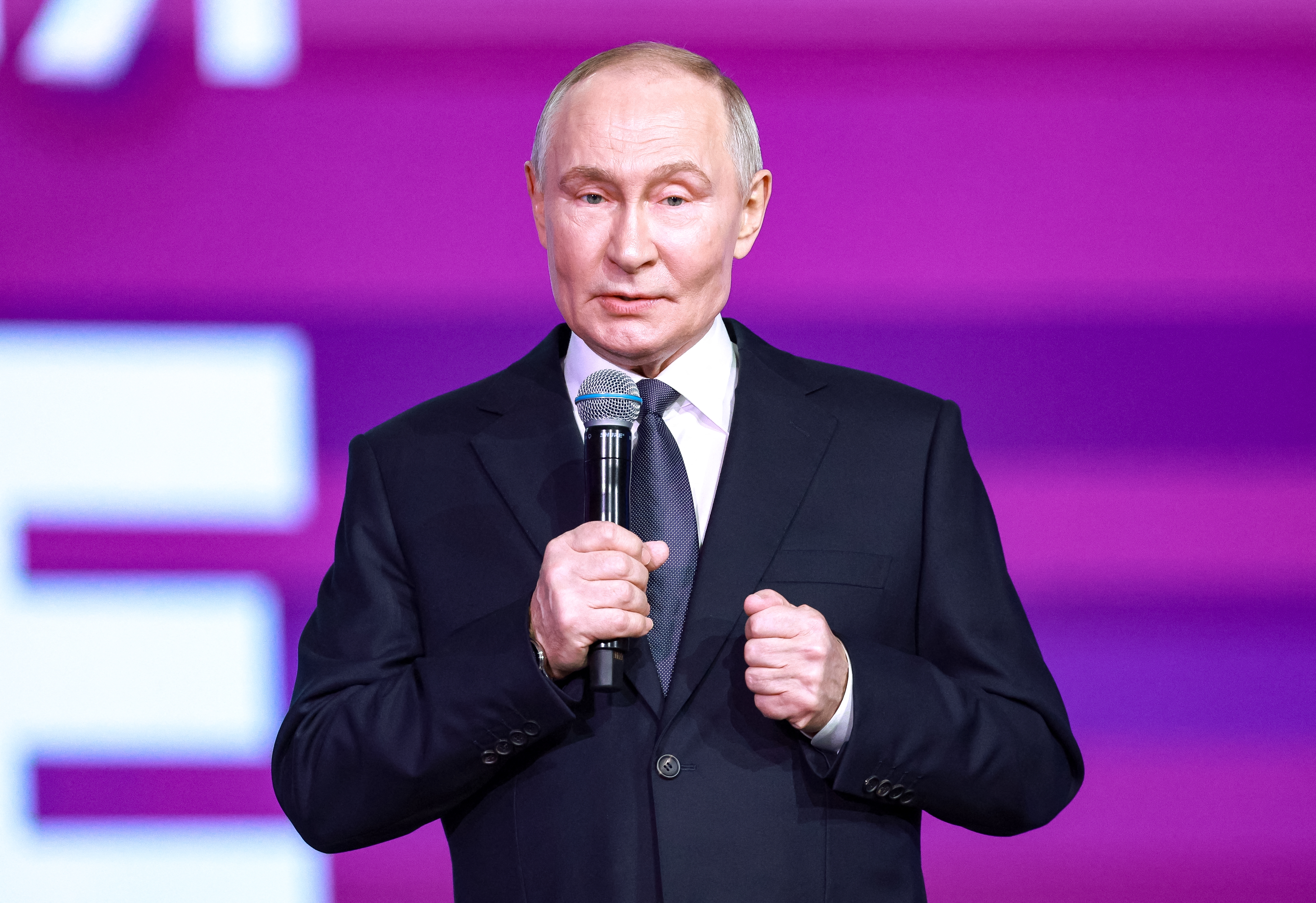 In this pool photograph distributed by the Russian state agency Sputnik, Russia's President Vladimir Putin attends a volunteer organisations forum in Moscow on December 3, 2025. (Photo by Alexander SHCHERBAK / POOL / AFP)