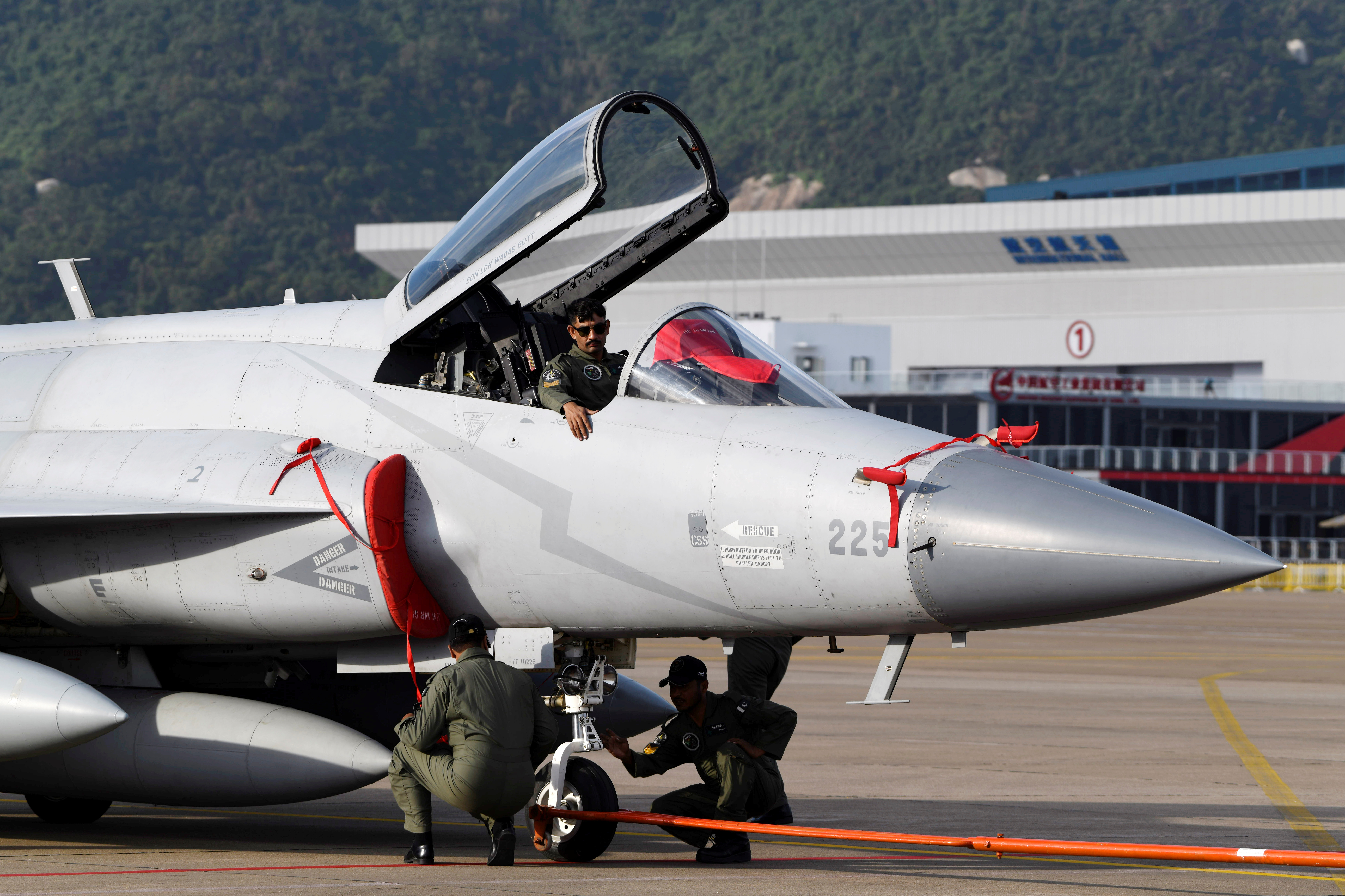Pakistan Air Force personnel check a JF-17 Thunder fighter jet ahead of the upcoming China International Aviation and Aerospace Exhibition, or Zhuhai Airshow, in Zhuhai, Guangdong province, China October 31, 2018. Picture taken October 31, 2018.REUTERS/Stringer ATTENTION EDITORS - THIS IMAGE WAS PROVIDED BY A THIRD PARTY. CHINA OUT.