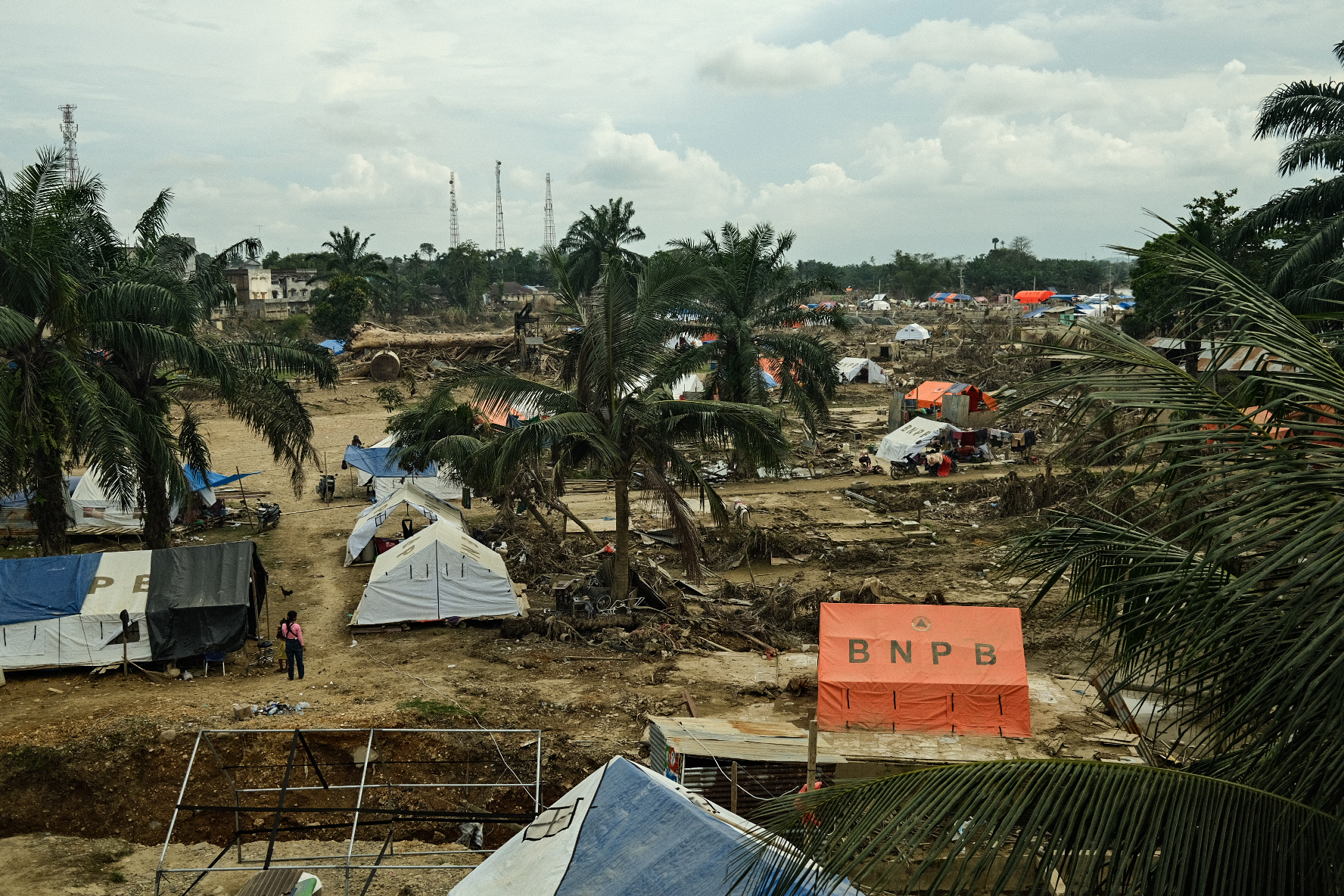 Al Jazeera observed that some households have received tents from government agencies, but many families are still staying in shelters they assembled on their own, using plastic scraps and debris from the floods.
