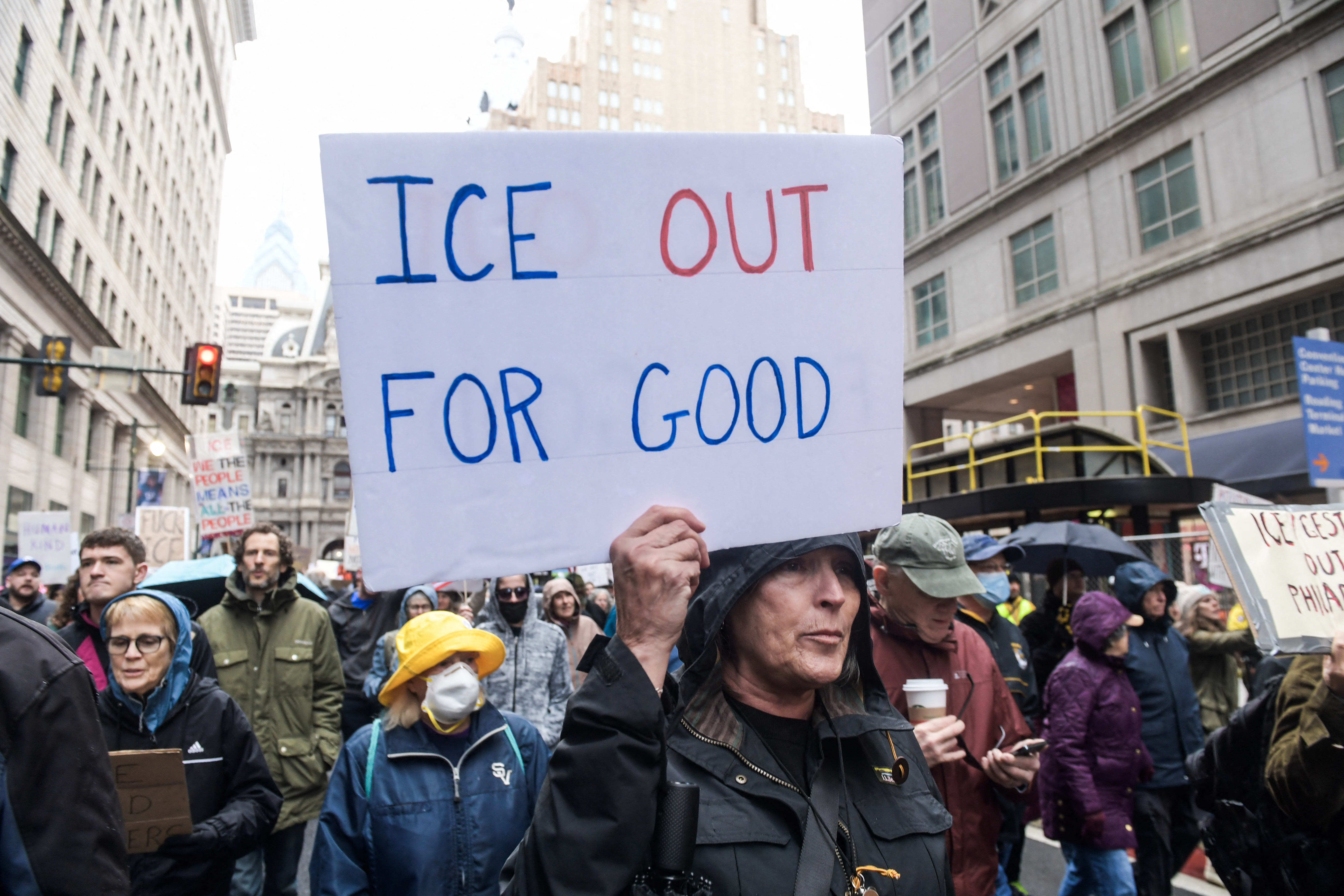 Protester holds sign that says ICE out for good