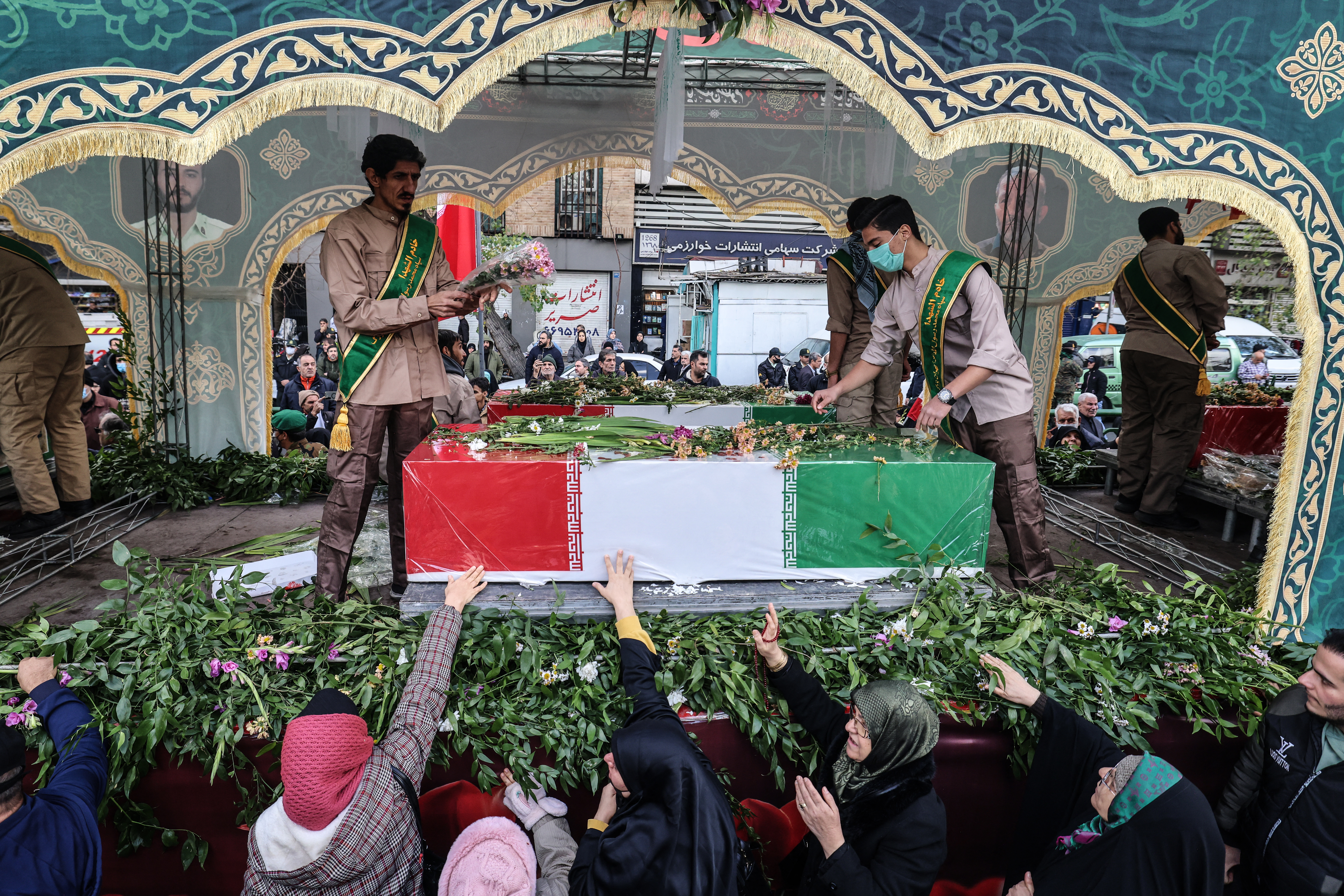 Iranians mourn during the funerals of security forces personnel killed in recent protests in Tehran