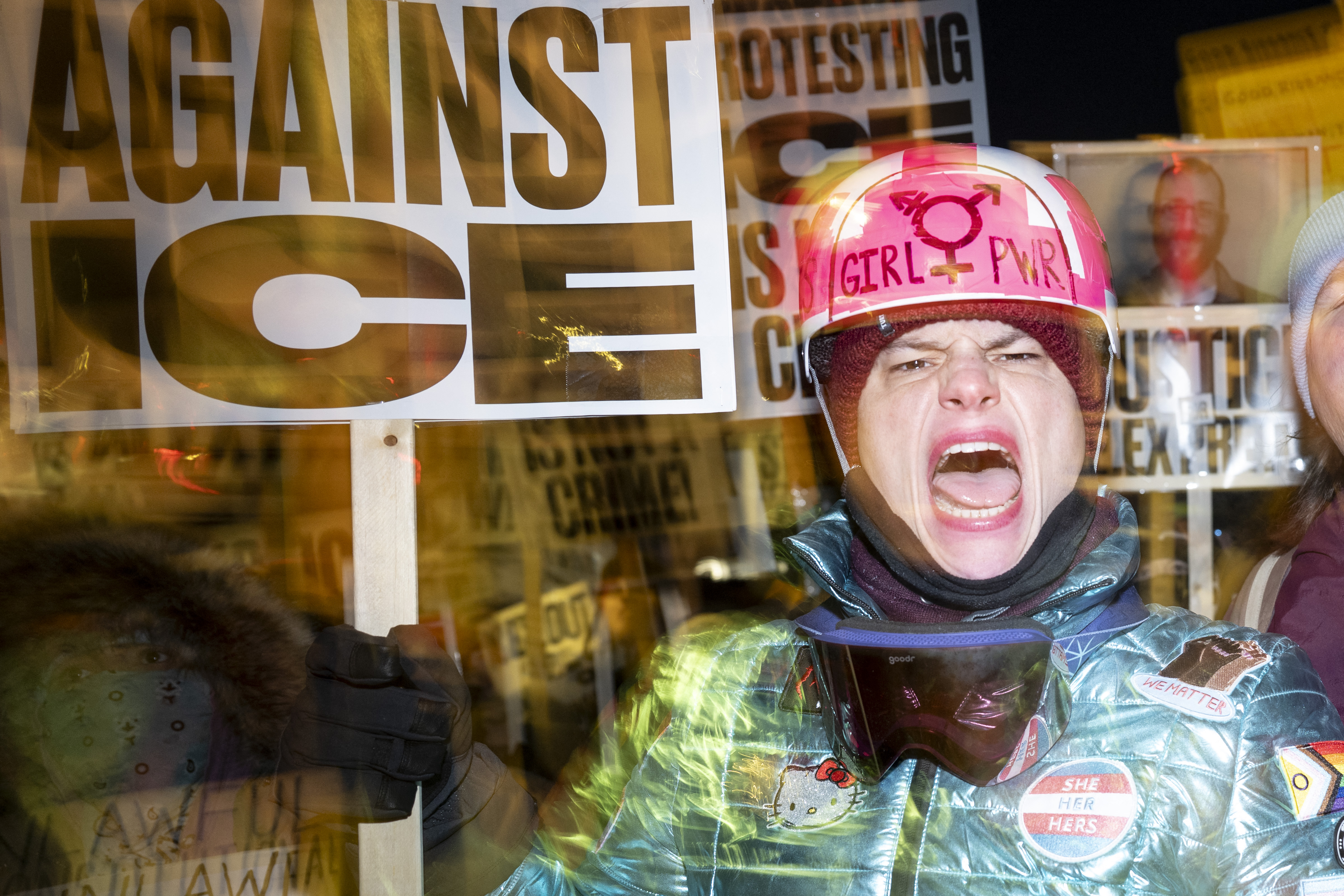 A group of anti-US Immigration and Customs Enforcement (ICE) protesters shout slogans in downtown Minneapolis, Minnesota, on January 27, 2026. US President Donald Trump said on January 27 that he would "de-escalate a little bit" in Minneapolis after the fatal shootings of two civilians fueled a storm of criticism over his signature immigration crackdown. [ROBERTO SCHMIDT / AFP]