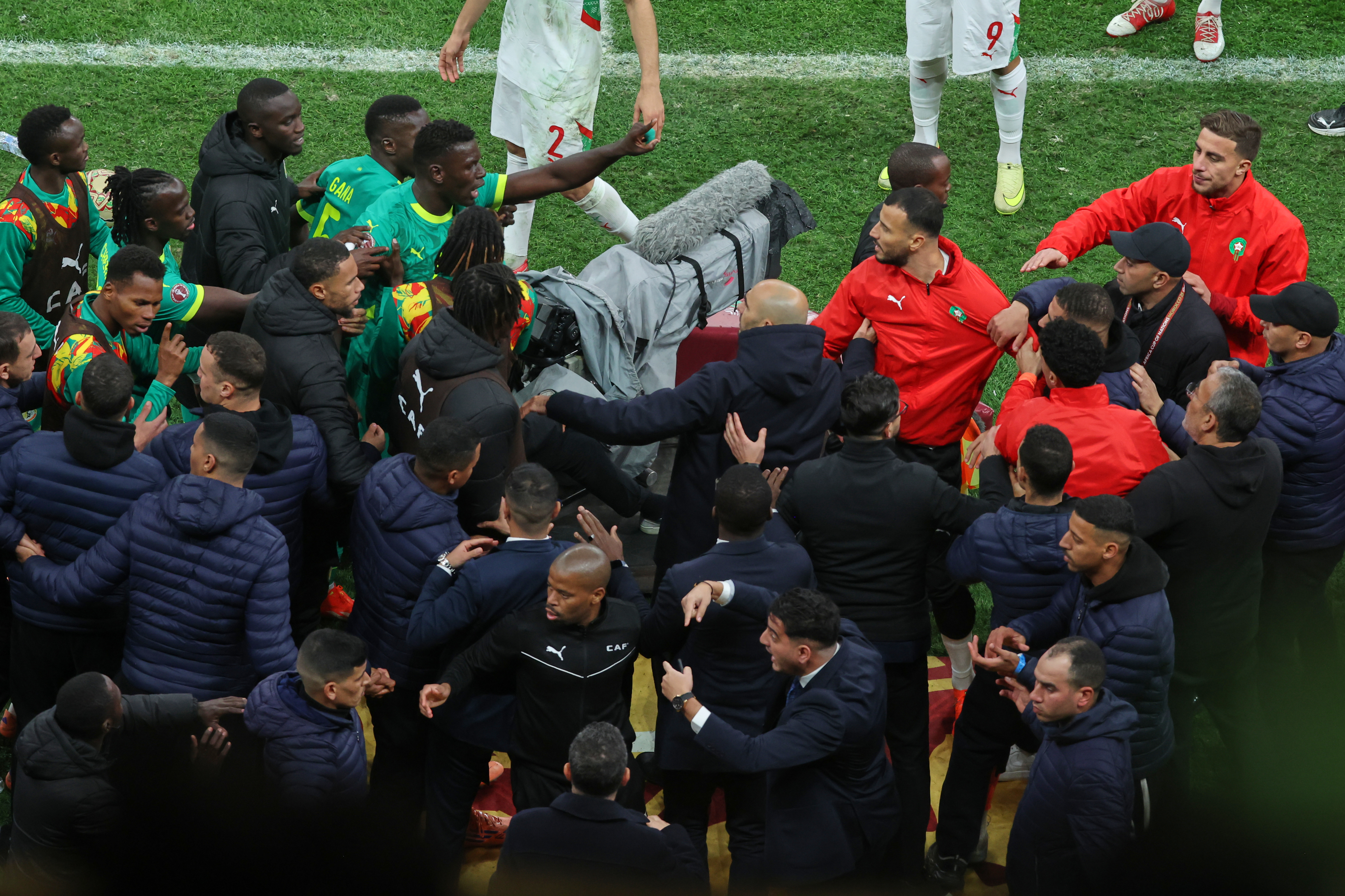 Senegal and Morocco players react.