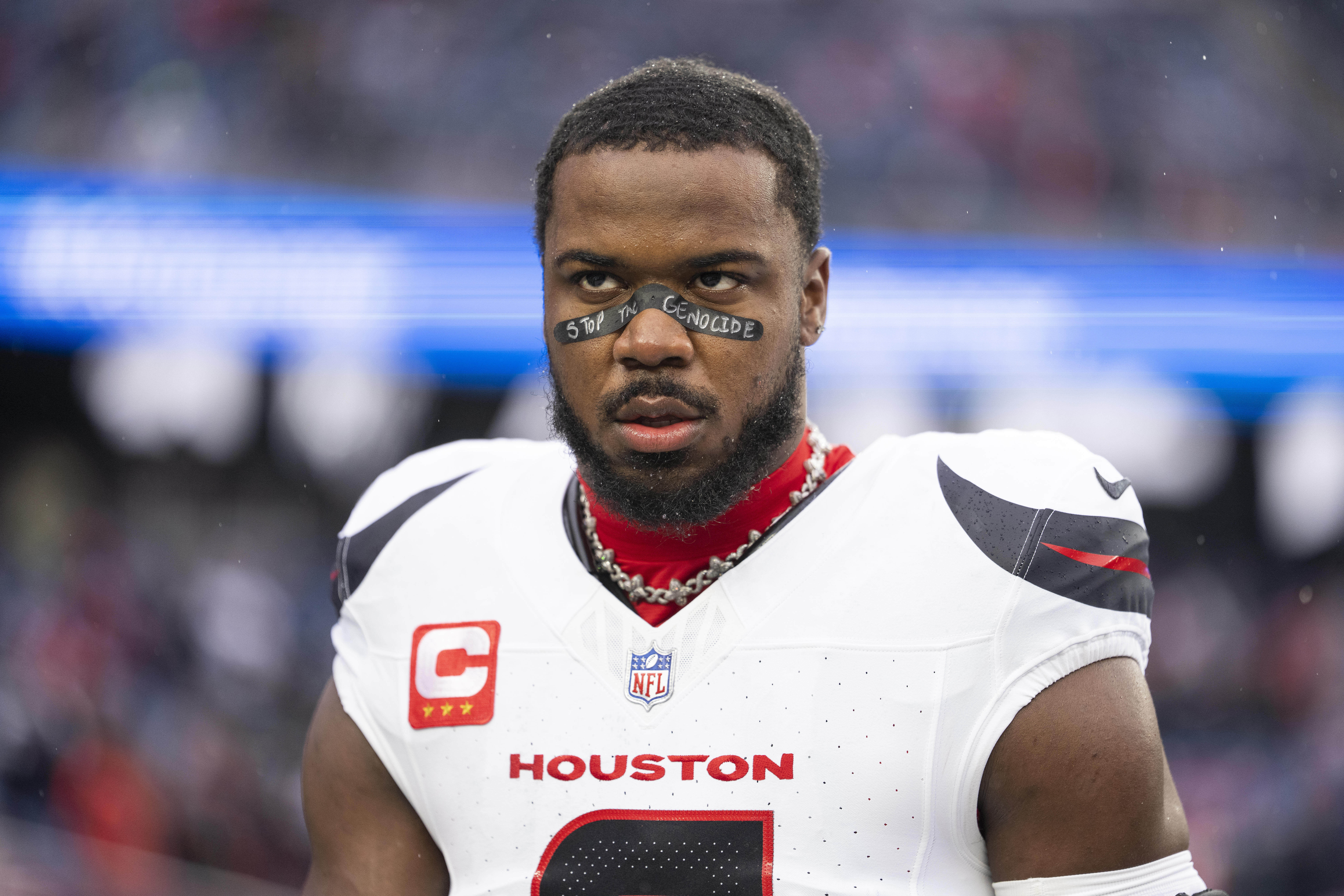 Azeez Al-Shaair #0 of the Houston Texans wears a 'Stop the Genocide' tape in a game.