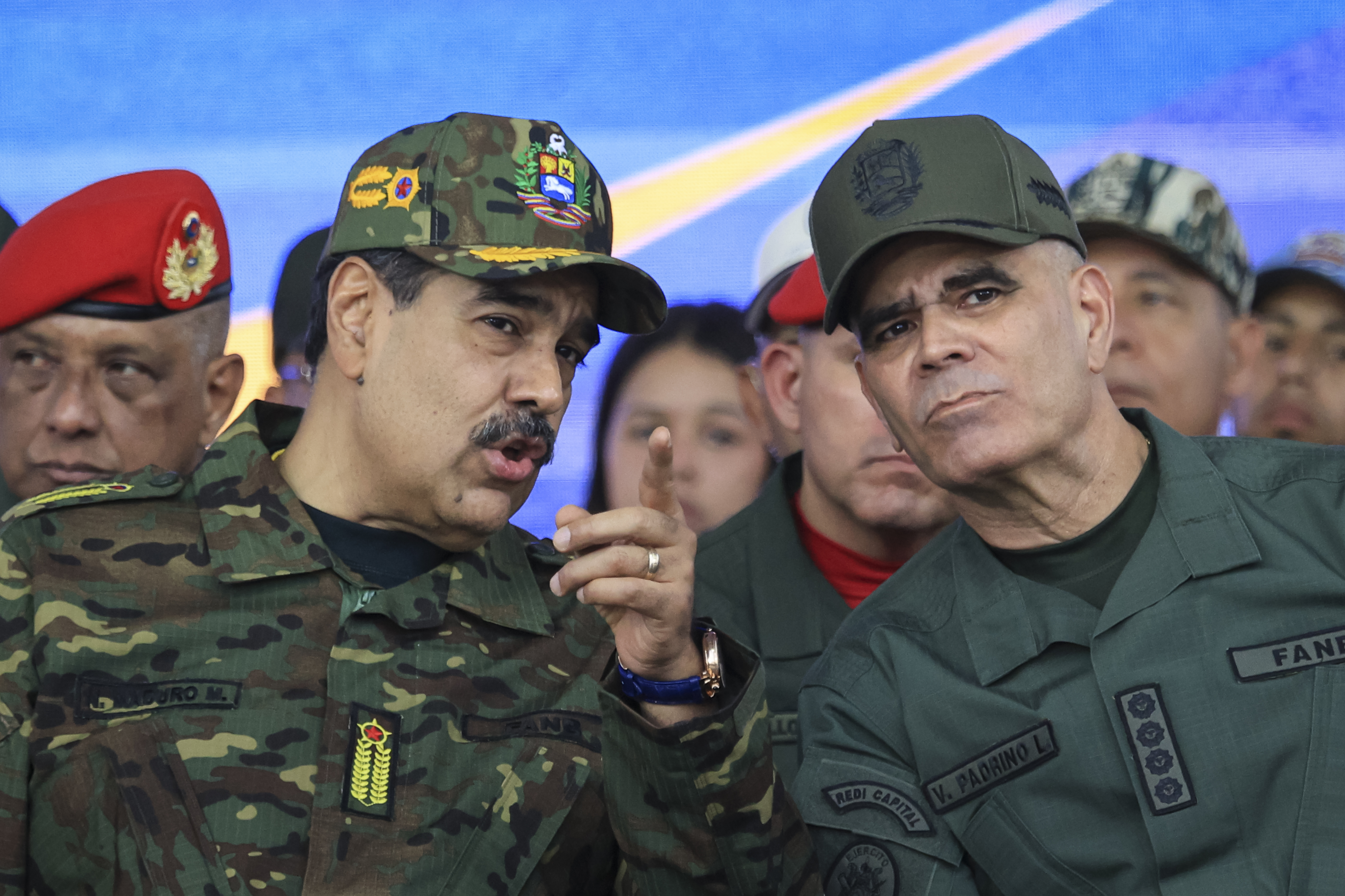 CARACAS, VENEZUELA - NOVEMBER 25: President of Venezuela Nicolás Maduro talks with Minister of Defense Vladimir Padrino Lopez during a military ceremony commemorating the 200th anniversary of the presentation of the 'Sword of Peru' to Venezuelan independence hero Simón Bolívar on November 25, 2025, in Caracas, Venezuela. The United States recently designated the "Cartel De Los Soles" (Cartel of The Suns) as a foreign terrorist organization, a group allegedly led by the president of Venezuela, Nicolas Maduro, and which, it is presumed, includes high-ranking members of the Venezuelan government. (Photo by Jesus Vargas/Getty Images)