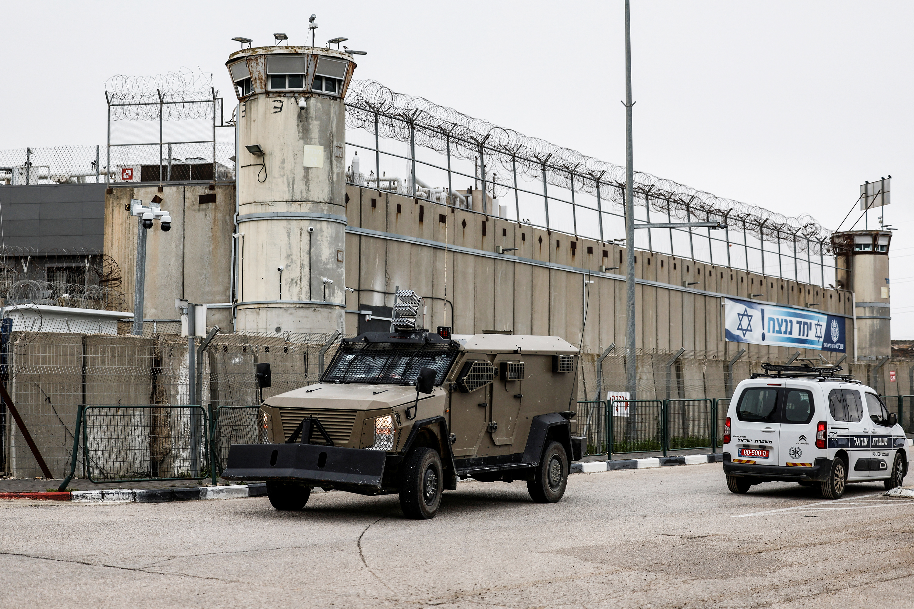 Vehicles move outside the Israeli military prison, Ofer