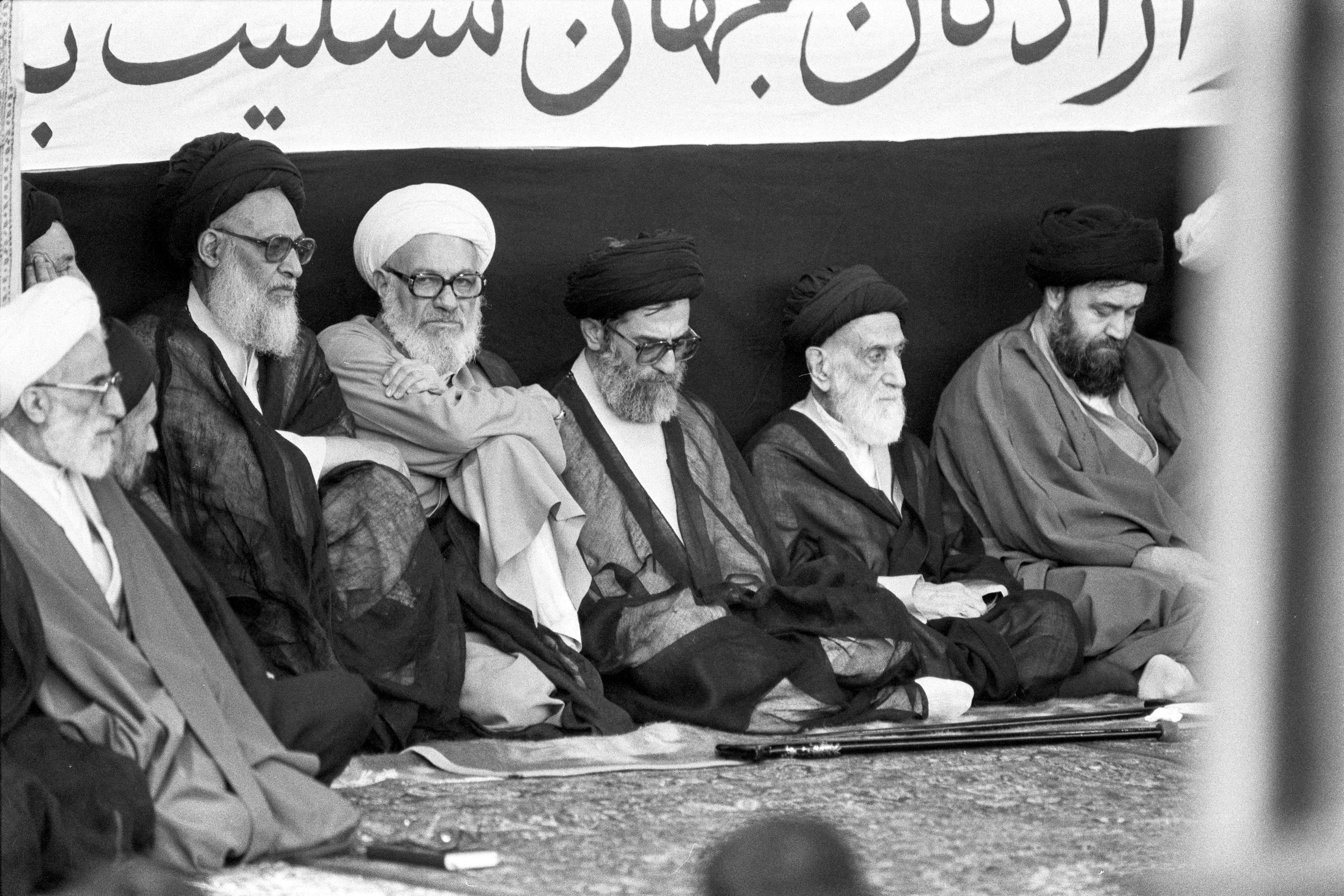 FILE PHOTO: Iran's Supreme Leader Ali Khamenei (3rd from R) attends a memorial service for the late Ayatollah Ruhollah Khomeini alongside senior officials including Ayatollah Azari Ghomi and members of the Khomeini family in Tehran, Iran, June 7, 1989. Ayatollah Passandideh, the brother of Khomeini, and Ahmad Khomeini, the son of Khomeini are also in attendance. June 7, 1989 REUTERS/Fatih Saribas 89255097/File Photo