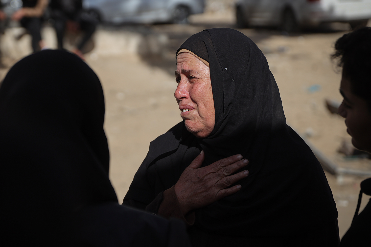 Hanaa Al-Mabhuh is looking for her missing son among returned corpses