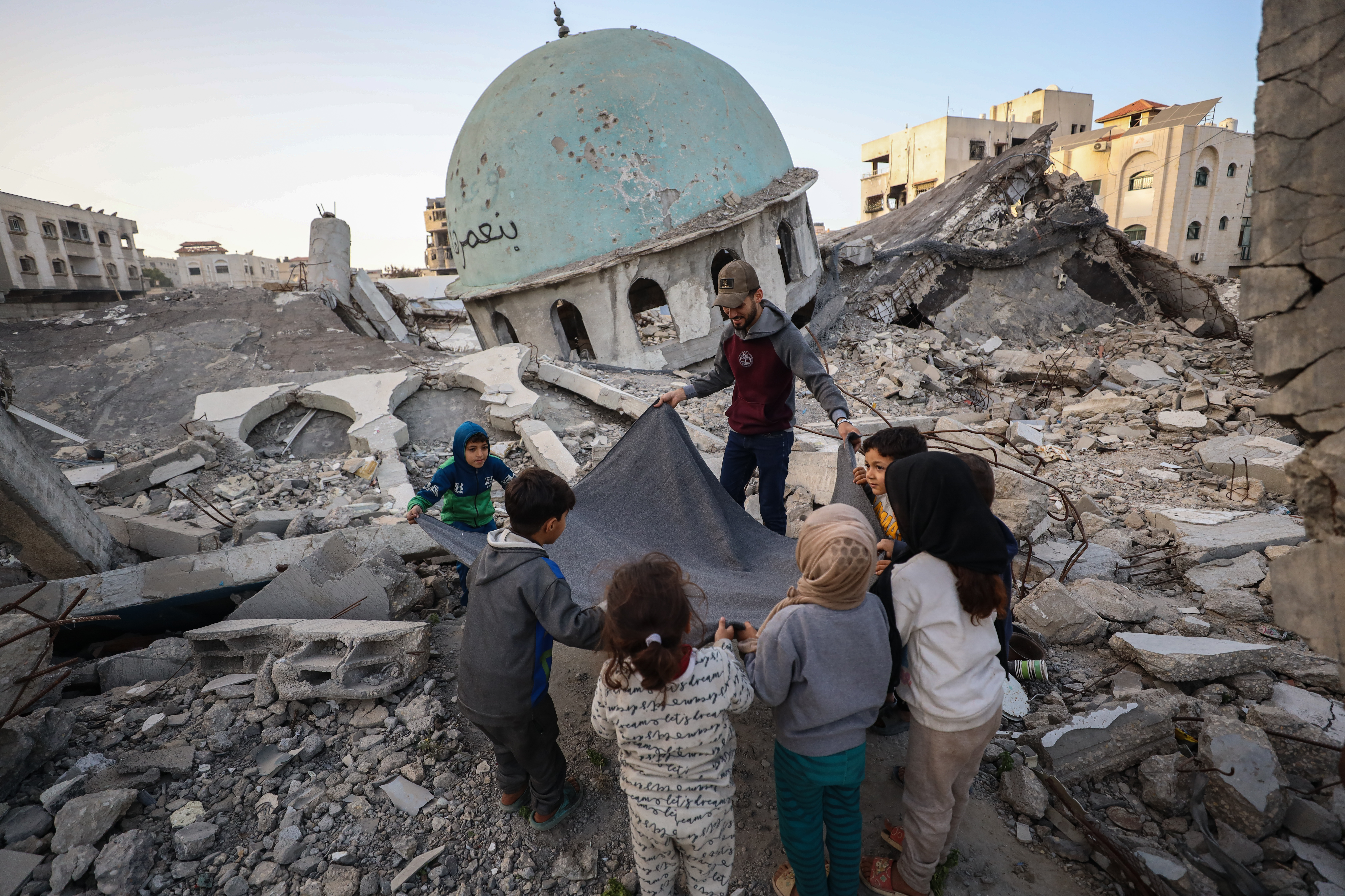 Palestinian family breaks first Ramadan fast on ruins of Mosque in Gaza