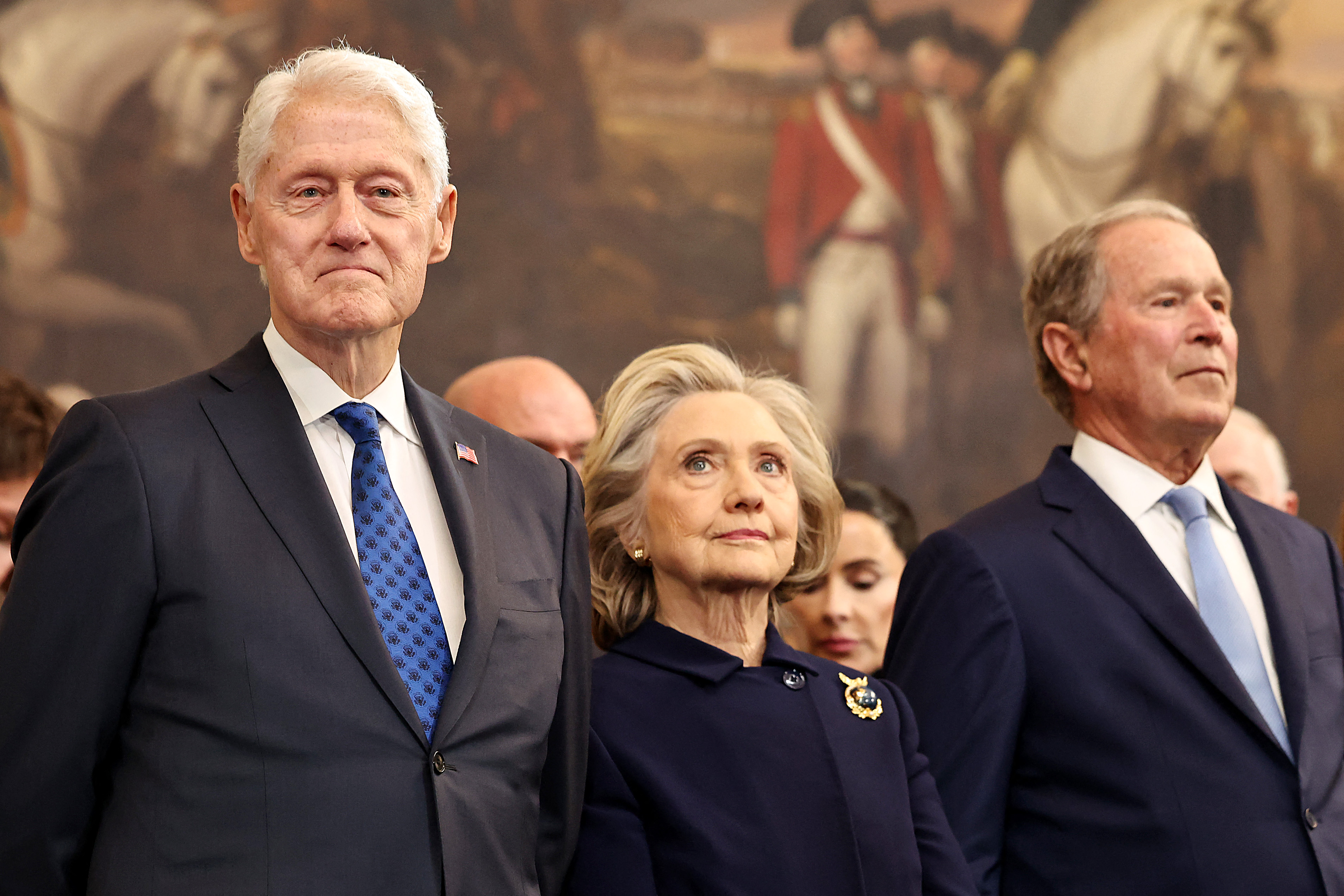 Former U.S. President Bill Clinton, former U.S. Secretary of State Hillary Clinton and former U.S. President George W. Bush attend the inauguration of U.S. President-elect Donald Trump in the Rotunda of the U.S. Capitol on January 20, 2025 in Washington, DC. Donald Trump takes office for his second term as the 47th president of the United States. (Photo by Chip Somodevilla / POOL / AFP)