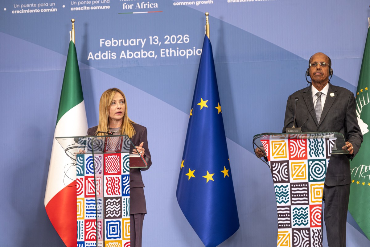 Italian Prime Minister Giorgia Meloni, speaks as Mahmoud Ali Youssouf (R), Chairperson of the African Union Commission listens on during the closing press conference of the Second Italy-Africa Summit at the Addis International Convention Center (AICC) in Addis Ababa on February 13, 2026. (Photo by Marco Simoncelli / AFP)