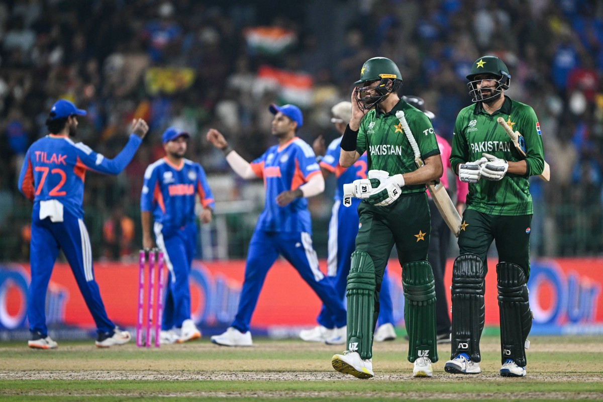 Pakistan's Usman Tariq (R) and Shaheen Shah Afridi walk back to the pavilion after team's loss at the end of the 2026 ICC Men's T20 Cricket World Cup group stage match between India and Pakistan in the R Premadasa Stadium of Colombo on February 15, 2026. (Photo by Ishara S.KODIKARA / AFP)