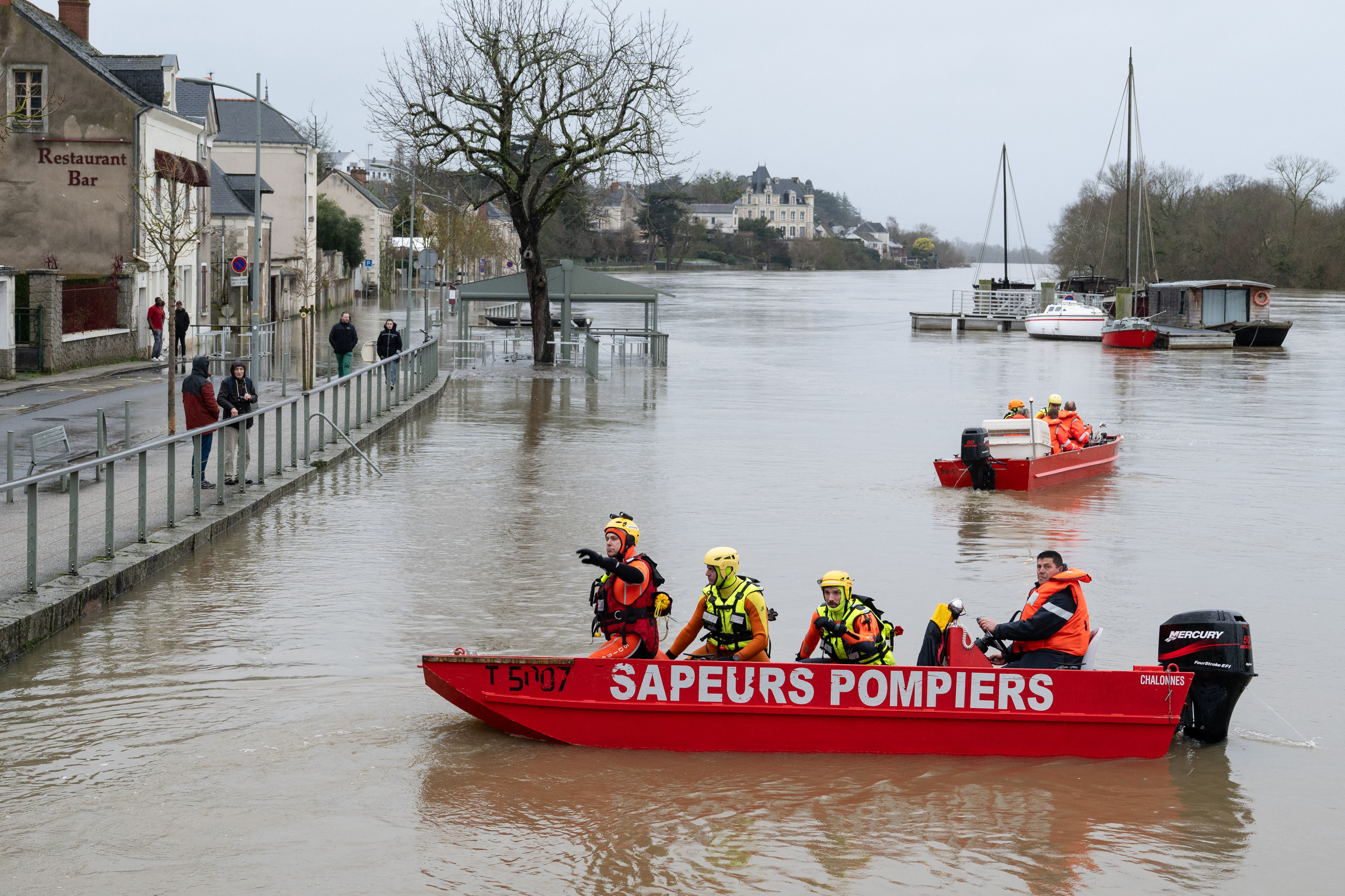French firefighters search for a man who disappeared in the Loire River.